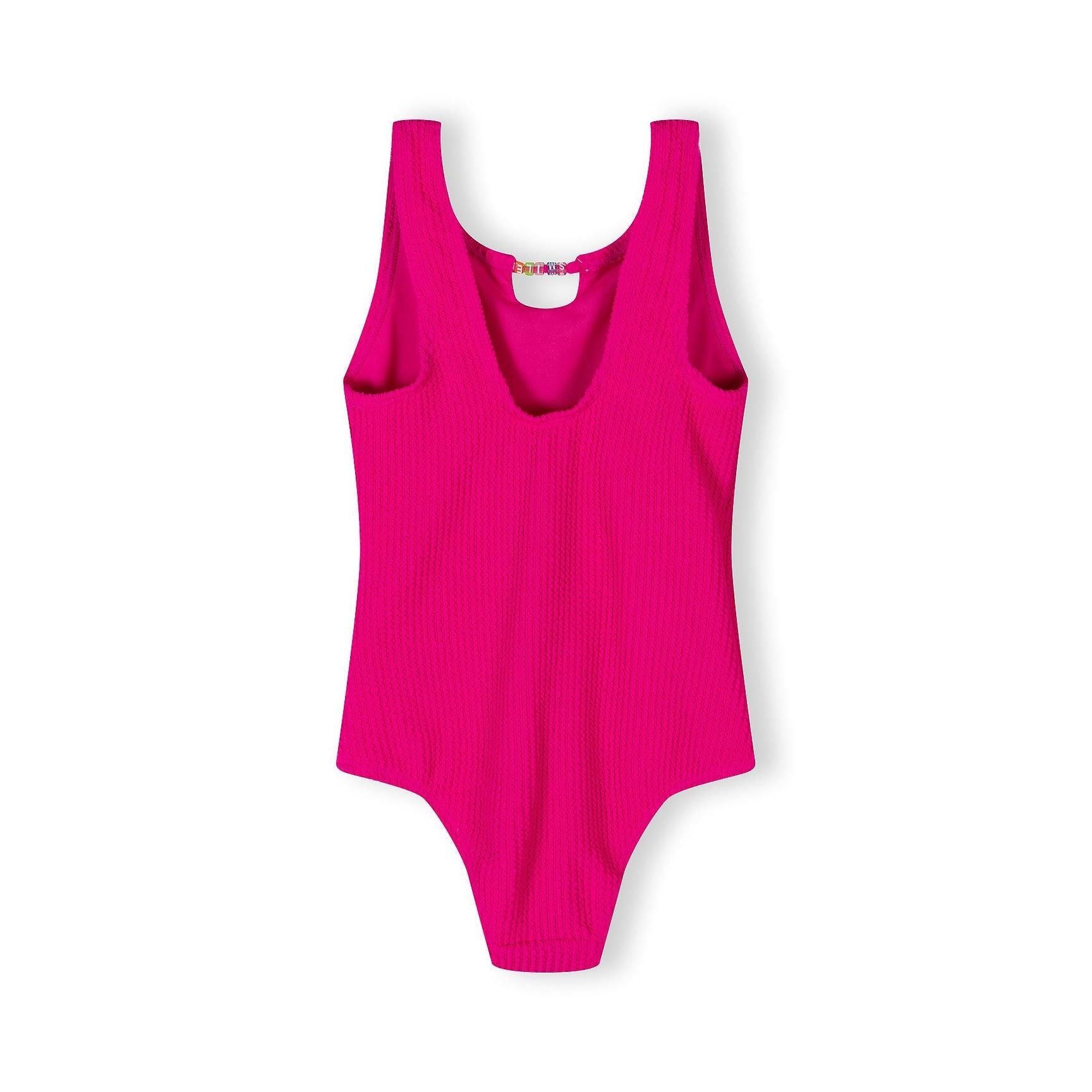 Back view of hot pink ribbed swimsuit showing scoop back design and pearl detail on white background