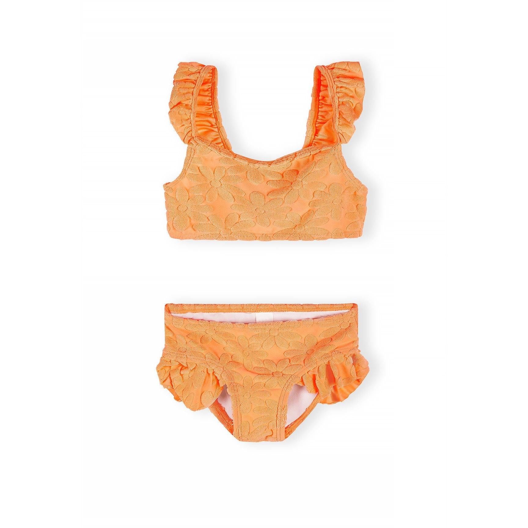 Neon orange floral jacquard bikini set displayed flat on white background showing crop top with frill straps and matching bottoms with ruffle details