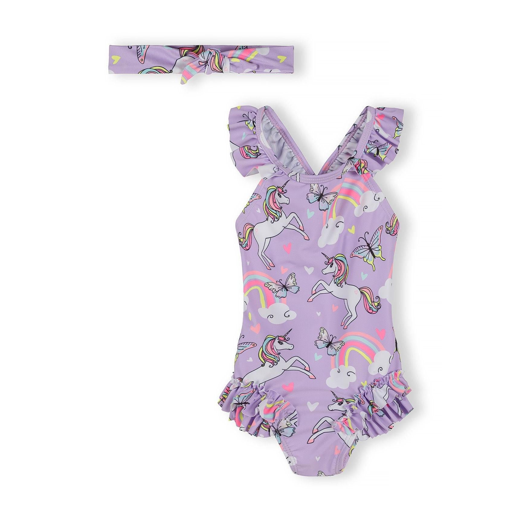 Lilac unicorn print swimsuit with ruffle straps and matching headband displayed against white background