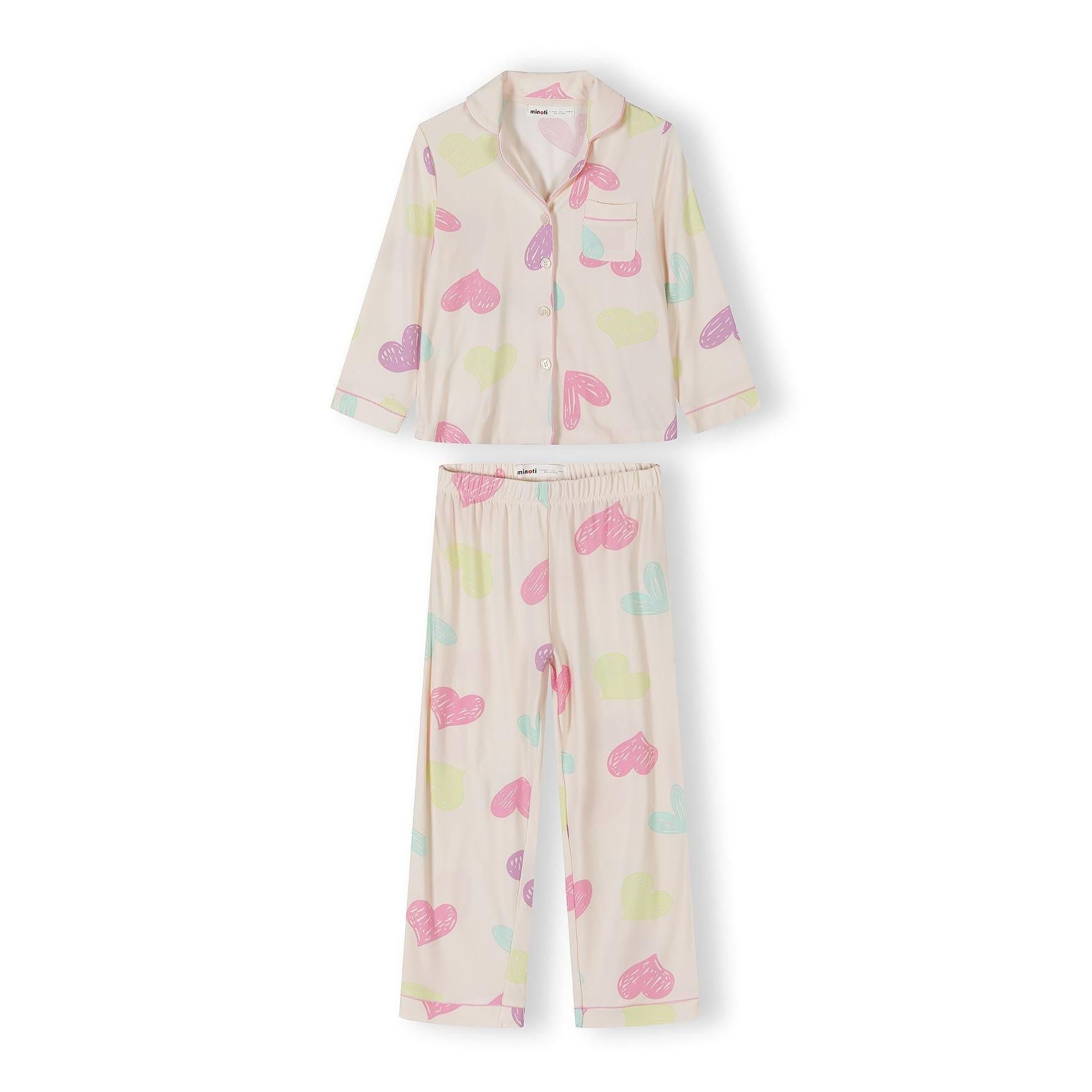 Pink pyjama set with heart pattern laid flat on white background showing long sleeve button-up top and matching bottoms