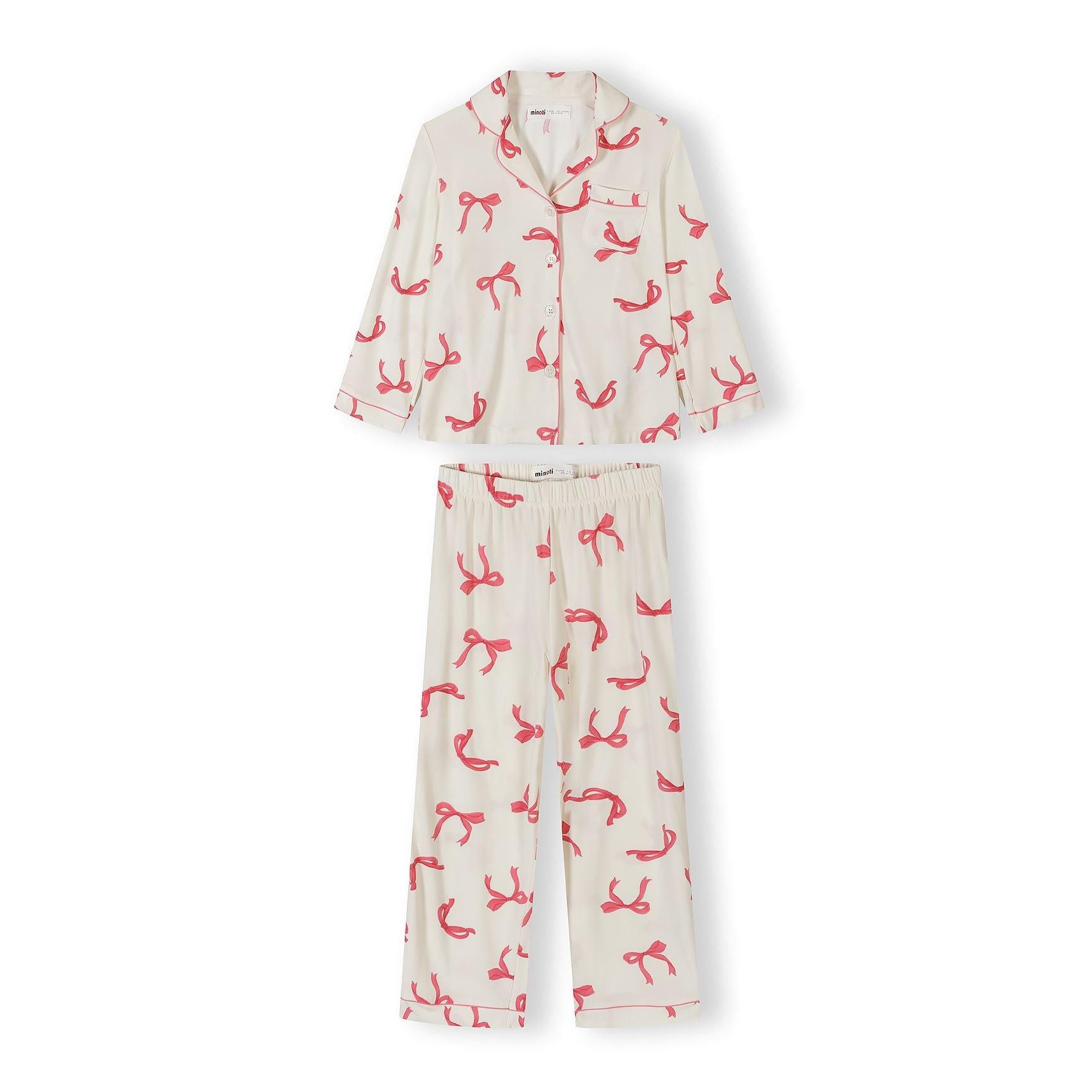 Full pyjama set with cream fabric featuring pink bow print, long sleeve button-up top and matching bottoms laid flat on white background