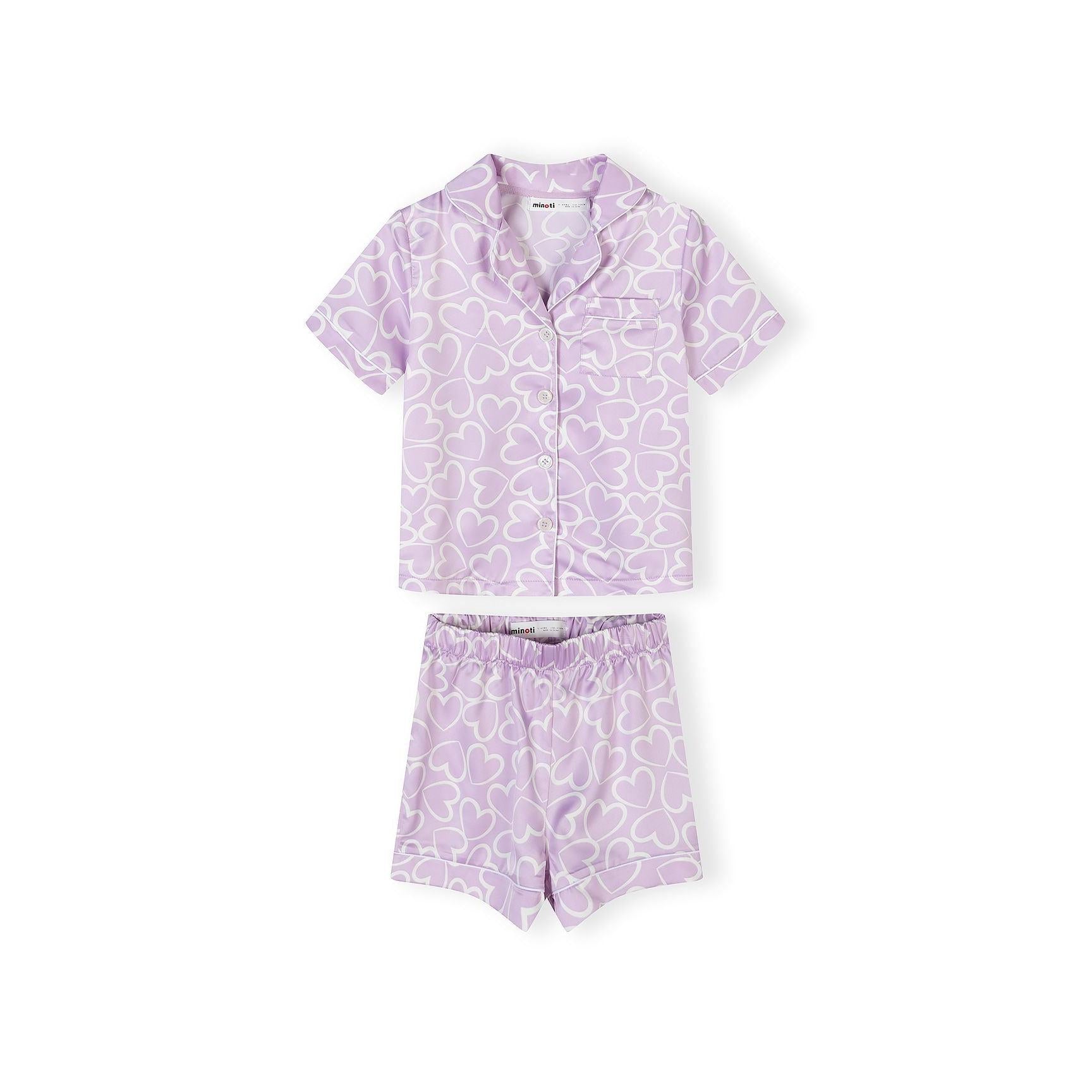 Lilac satin pyjama set with white heart print showing button-front shirt and matching shorts laid flat on white background