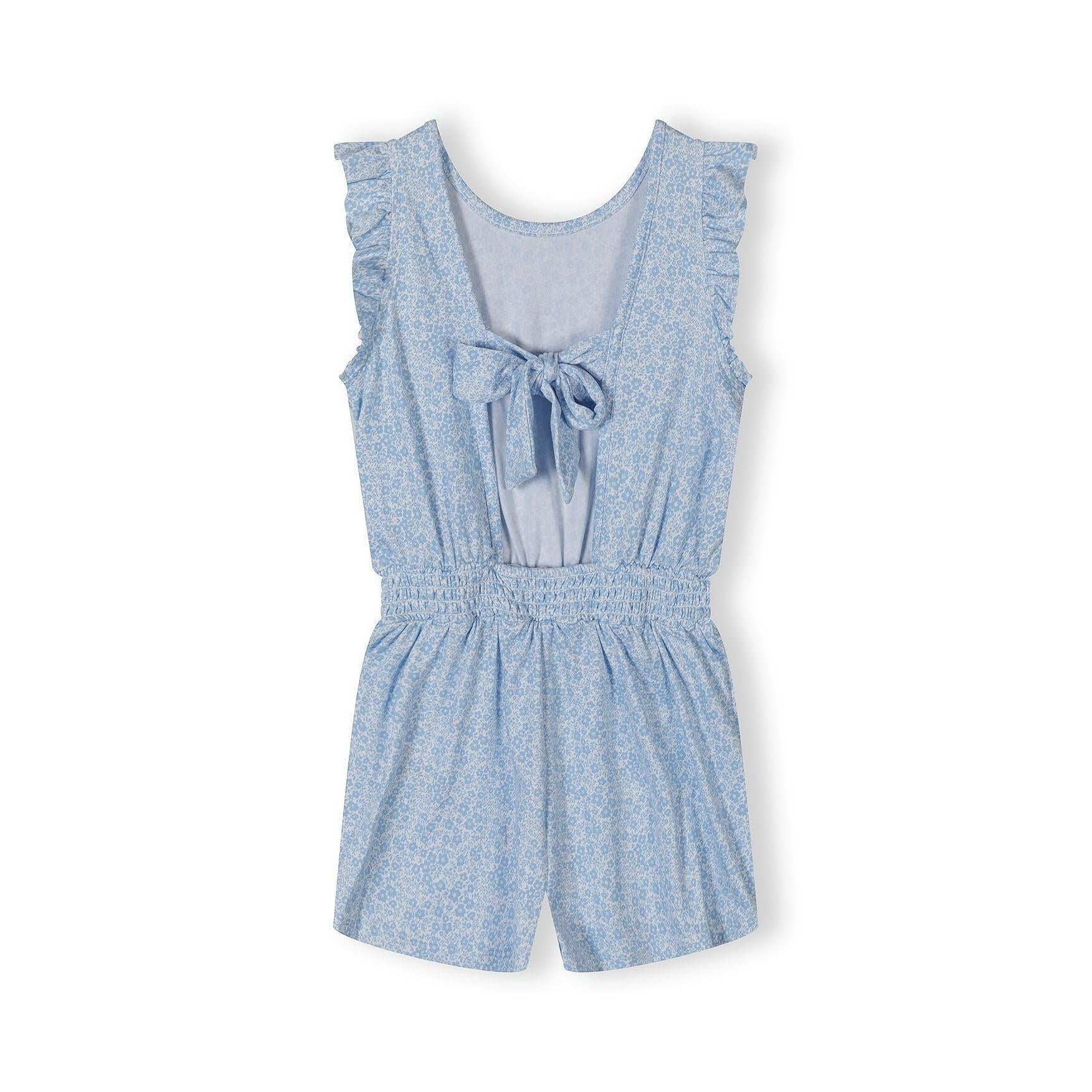 Close-up detail of blue floral jumpsuit showing ruffle sleeve trim and delicate floral print pattern on fabric