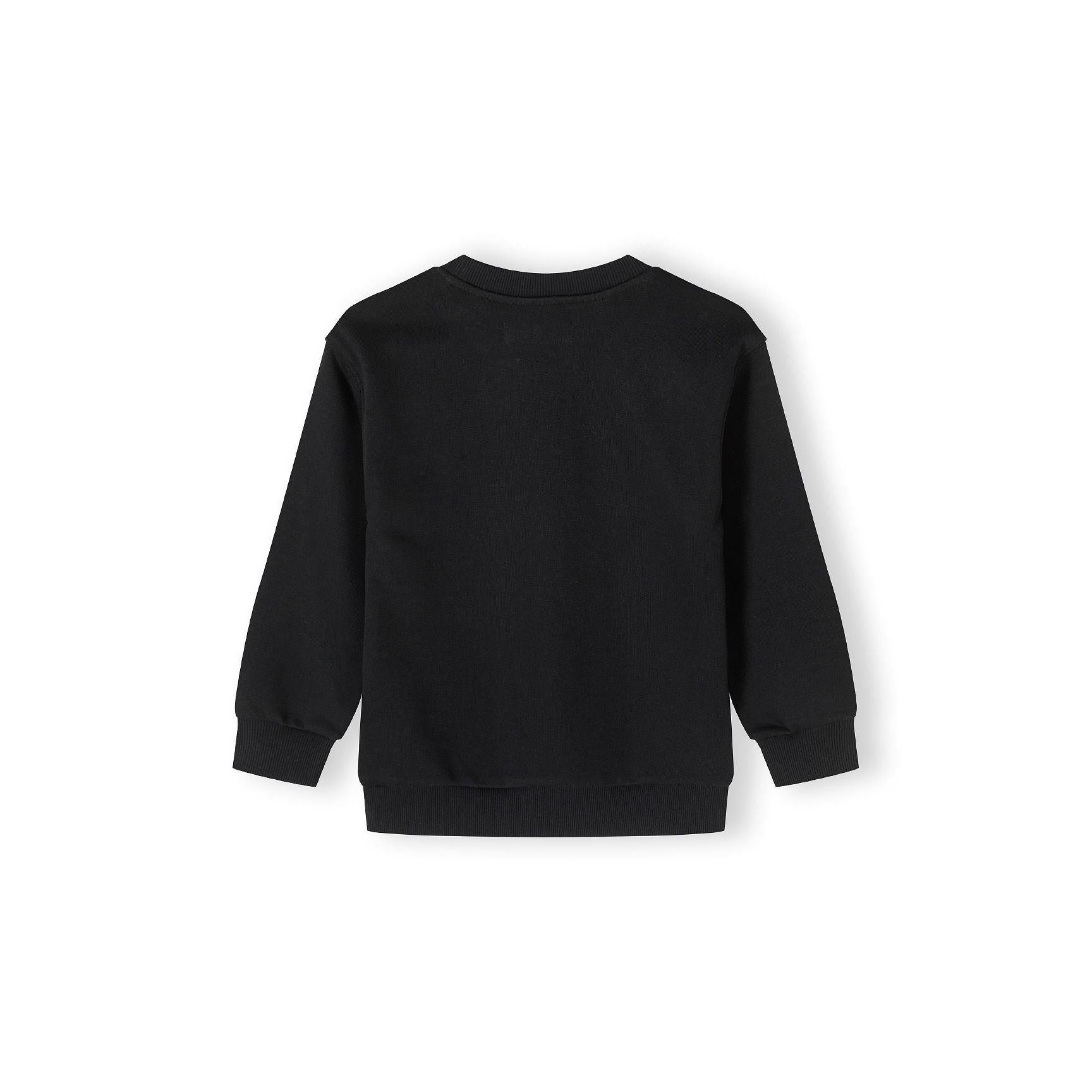 Back view of black crew neck sweatshirt laid flat showing plain design with ribbed collar, cuffs and hem against white background