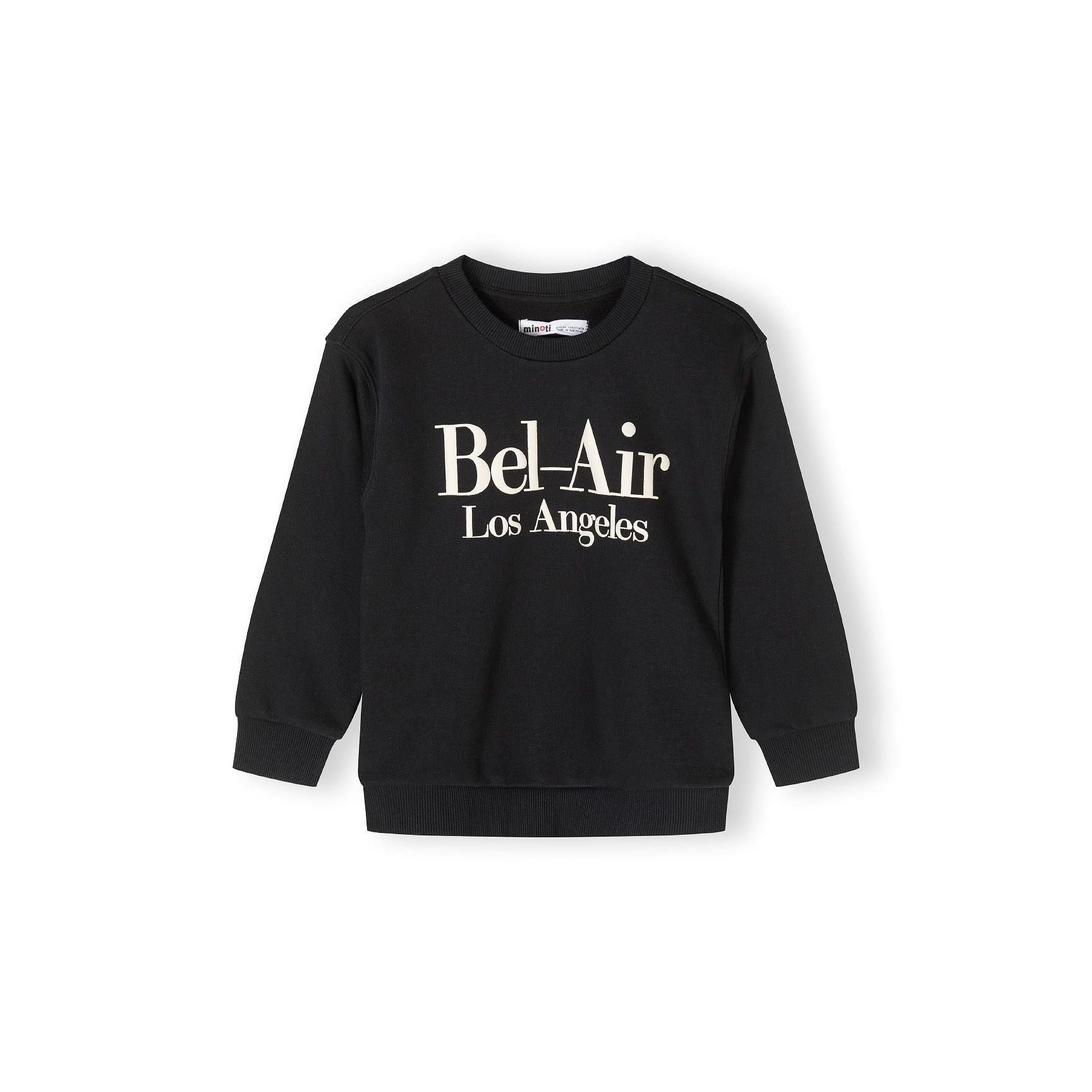 Back view of black crew neck sweatshirt laid flat showing plain design with ribbed collar, cuffs and hem against white background