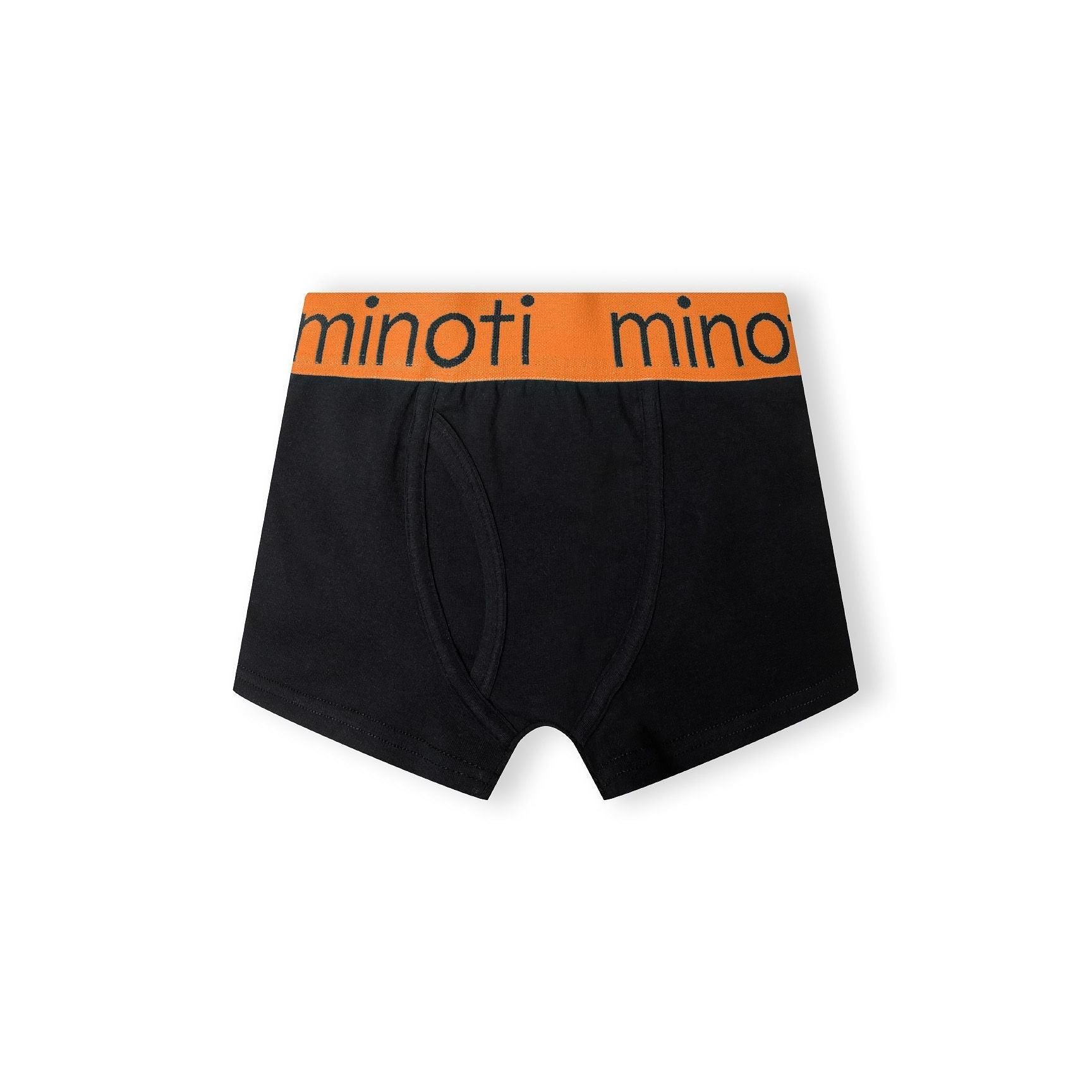 Single black trunk with orange waistband featuring Minoti branding, laid flat on white background displaying the comfortable fit and quality construction