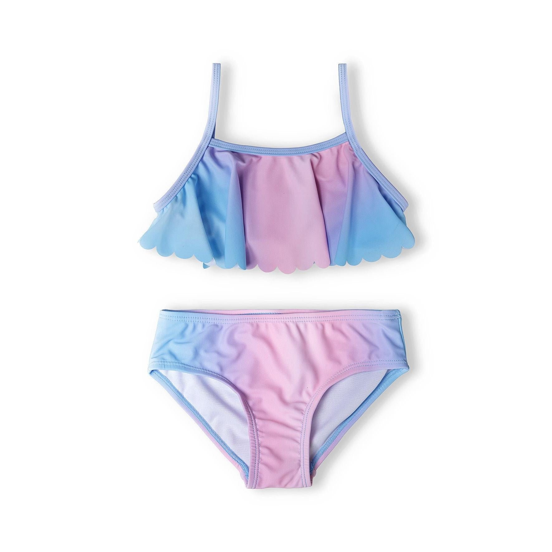 Blue pink gradient bikini set laid flat showing bandeau top with scalloped ruffle detail and matching briefs on white background