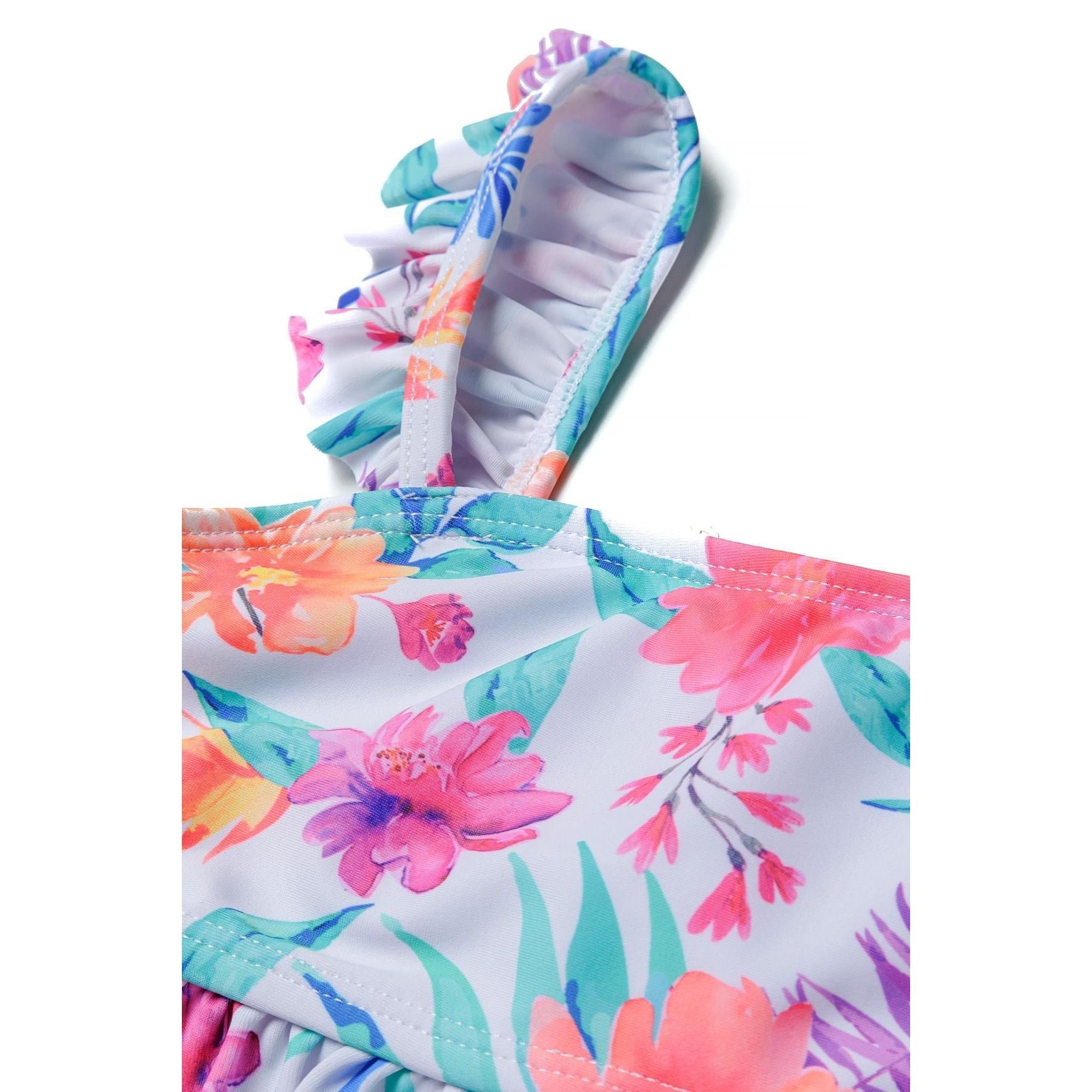 Detail shot of tropical floral bikini showing ruffled strap construction and vibrant hibiscus flower print in pink, coral and turquoise colors