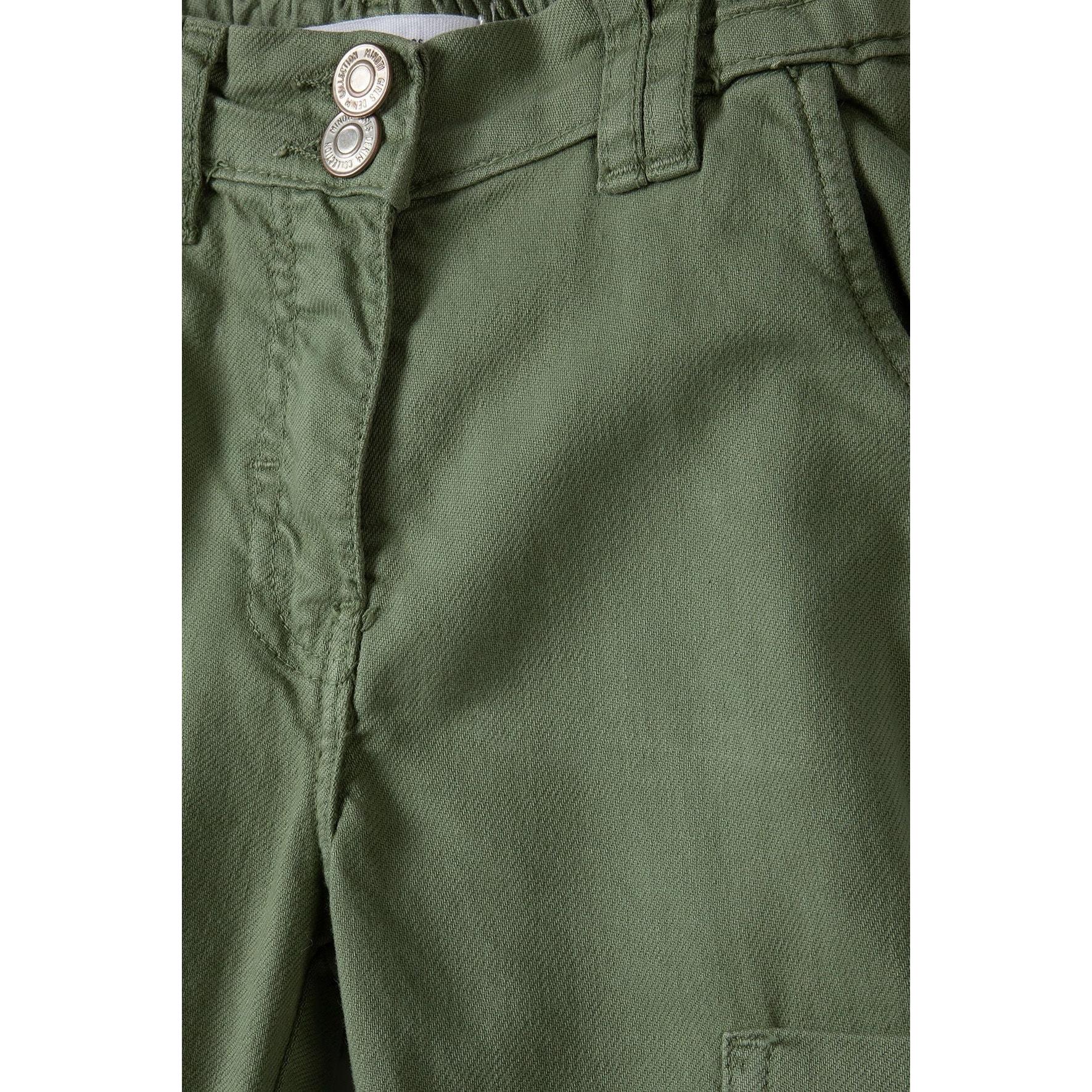 Close-up detail of khaki cargo trousers showing double button fastening and zip fly closure