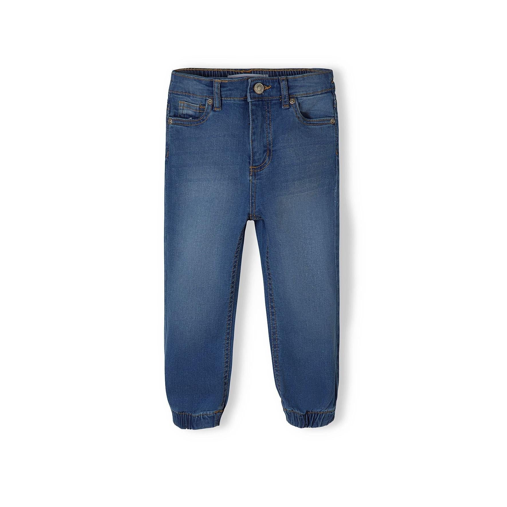 Front view of navy denim jogger jeans on white background showing zip fly closure, front pockets, and elasticated cuffs