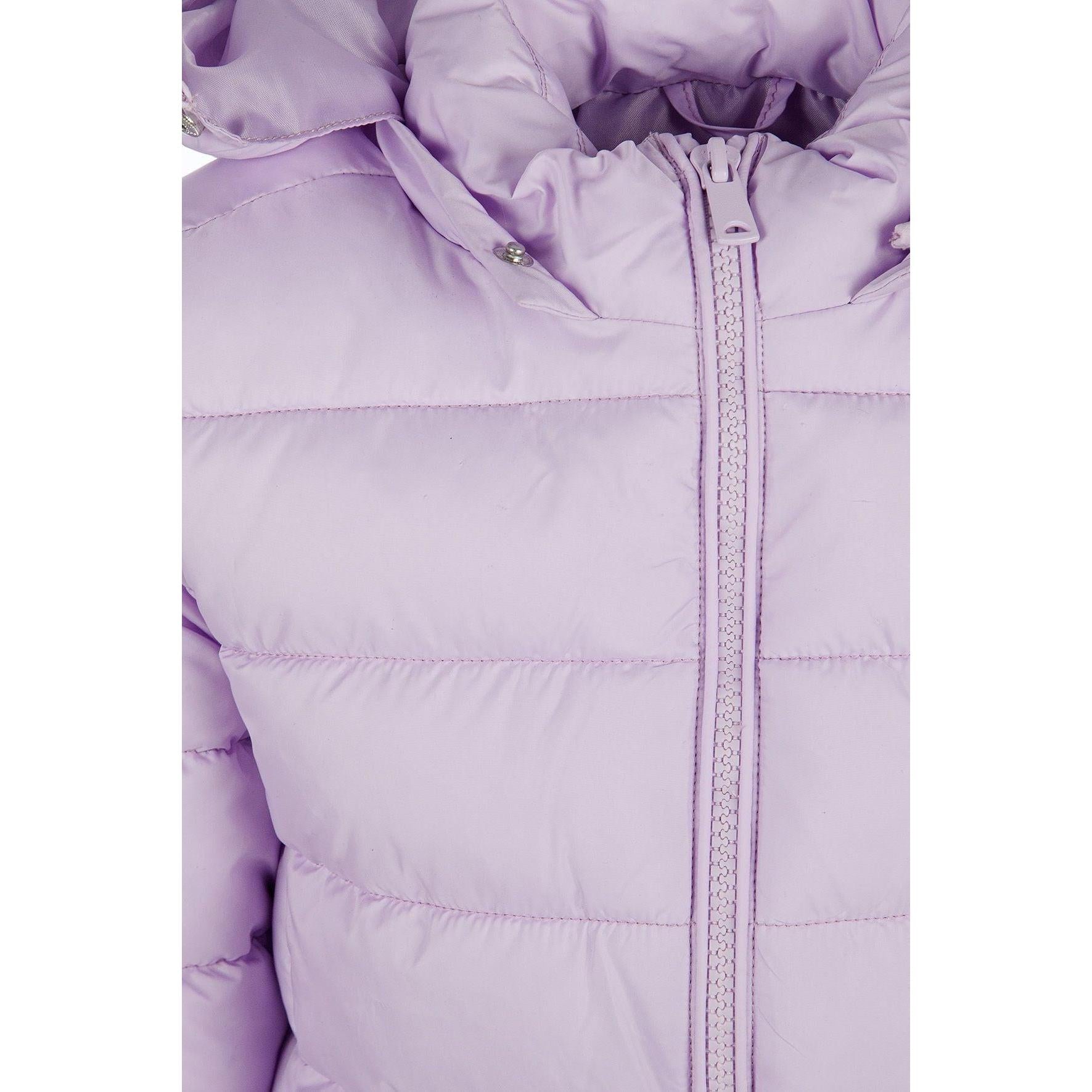 Detail view of lilac quilted jacket zip area and quilted padding pattern with hood visible