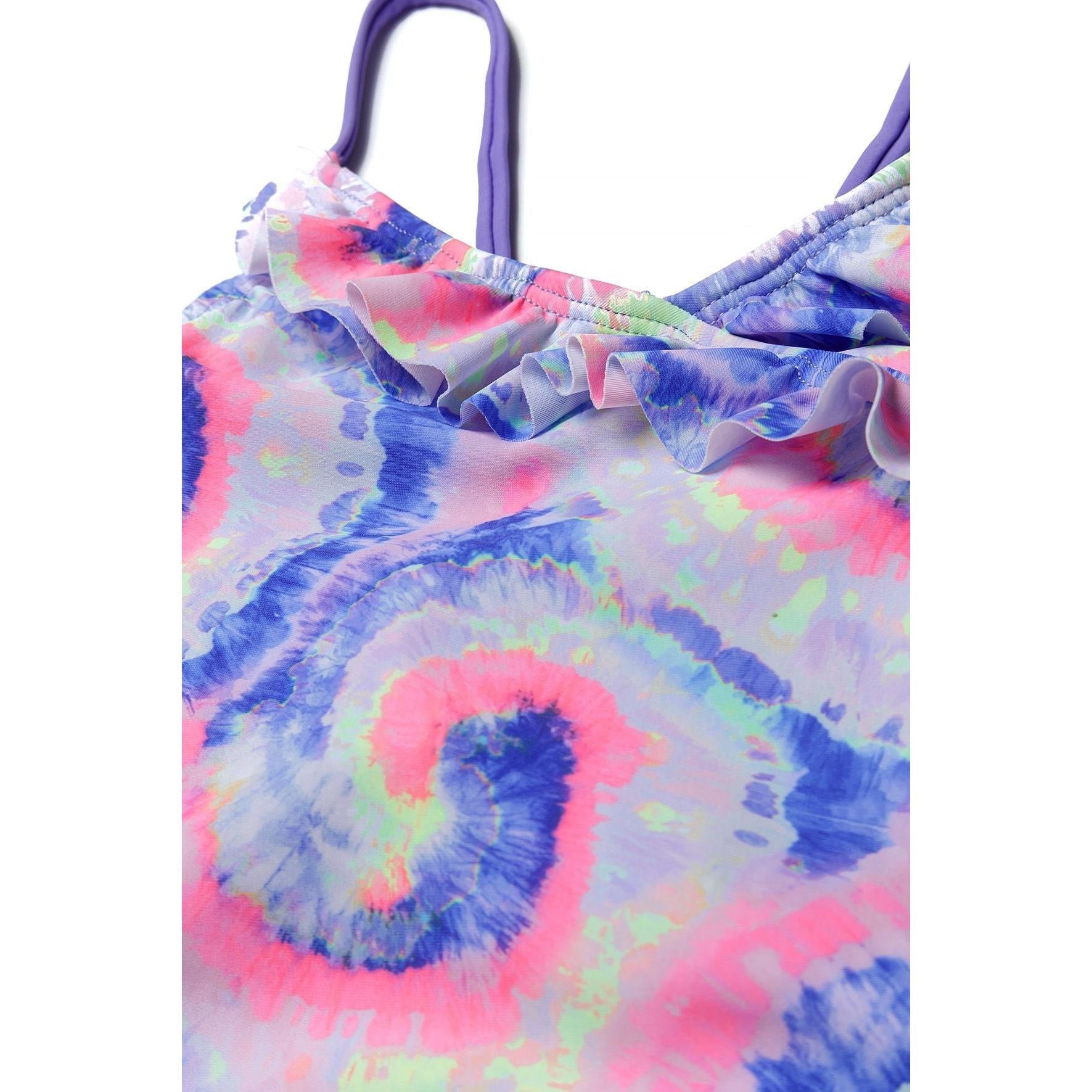 Close-up detail view of ruffle trim and tie-dye fabric showing the soft lilac base with pink and blue swirl patterns