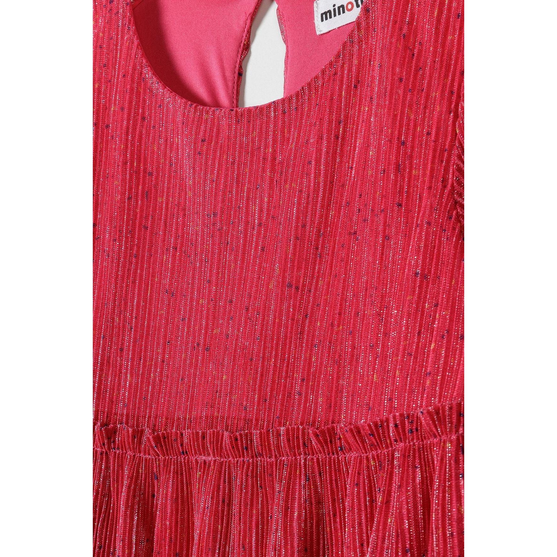 Close-up detail of pink sparkle fabric texture showing metallic shimmer effect and tiered construction with Minoti label visible