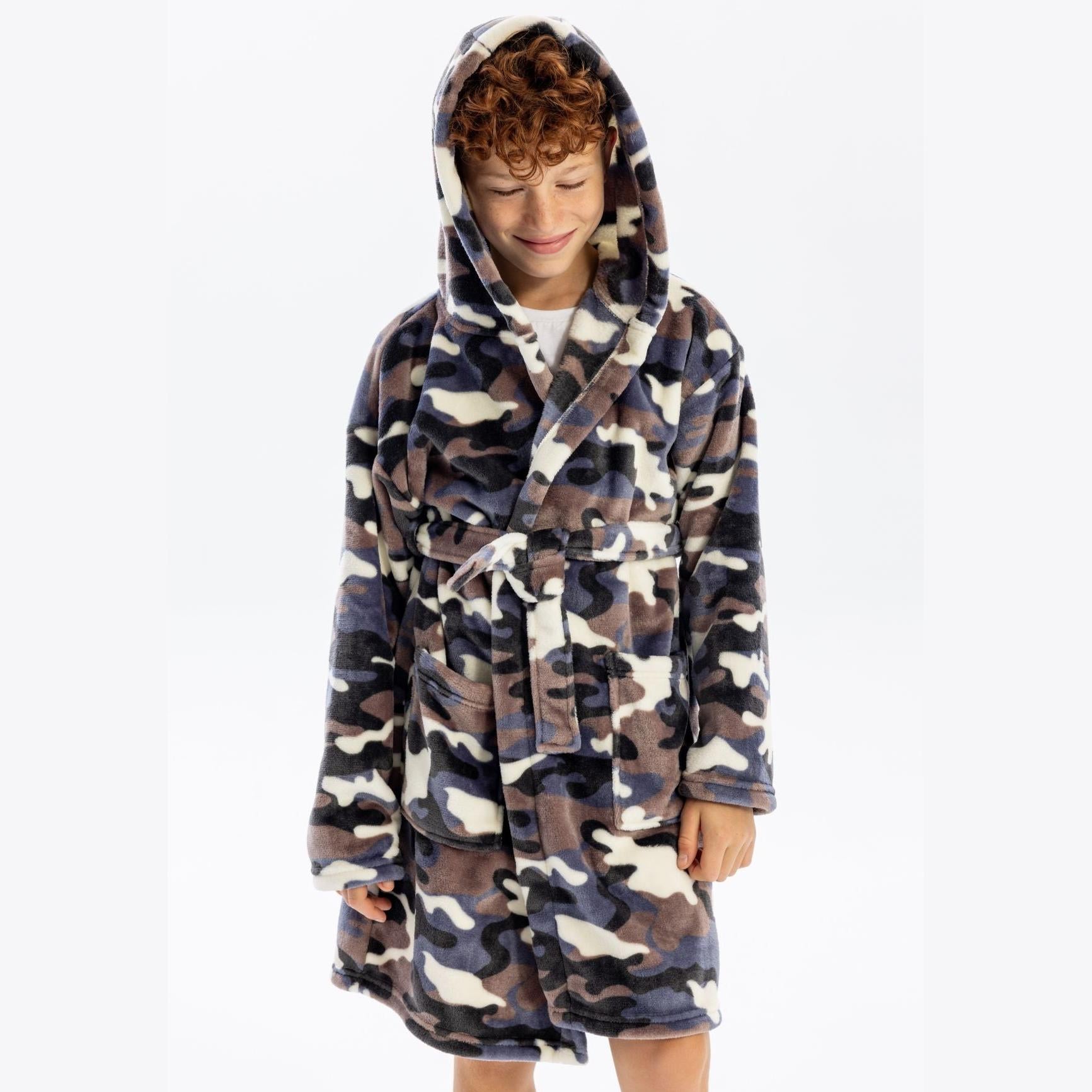 Child wearing camouflage fleece bathrobe with hood up, tie belt fastened, front view on white background