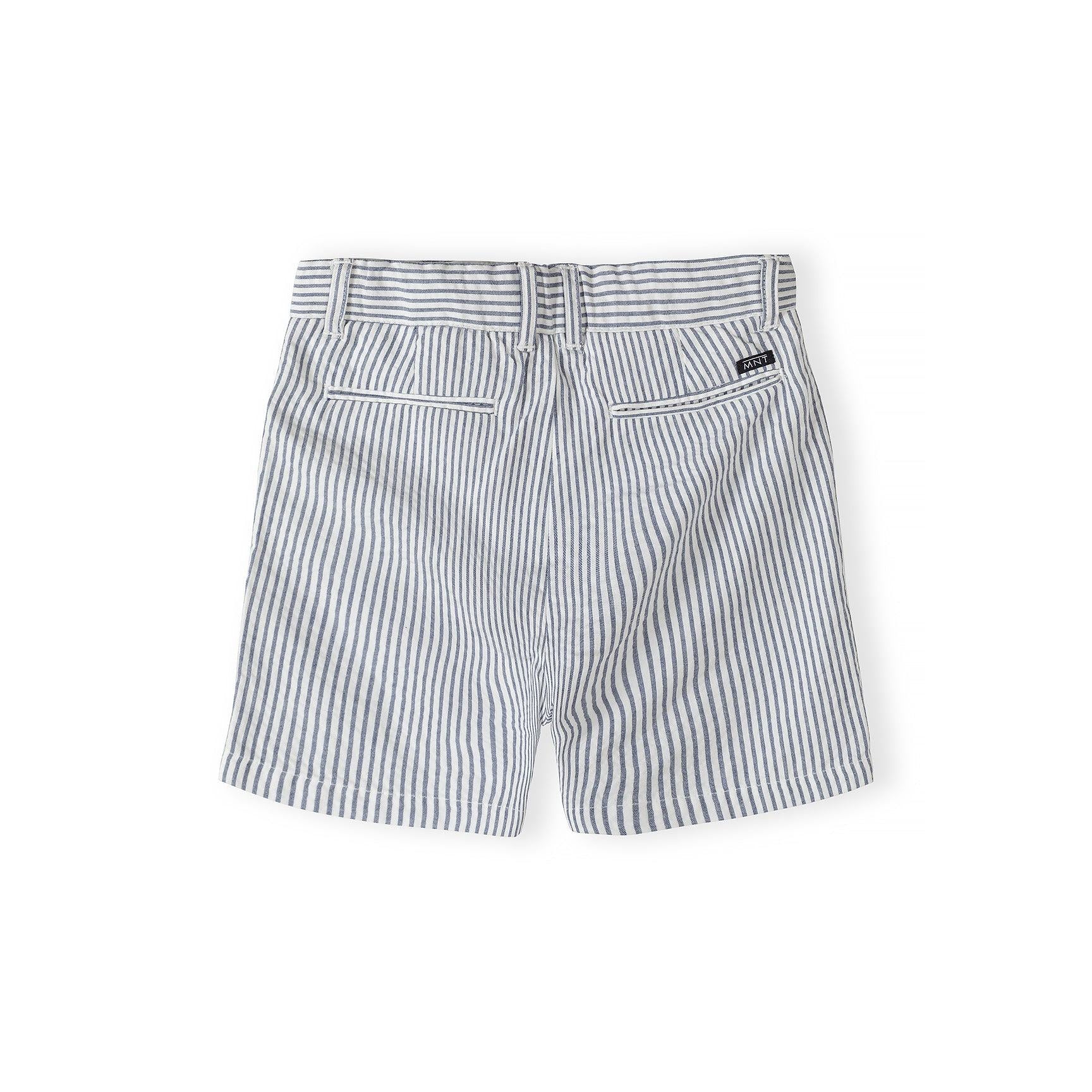 Back view of navy and white striped tailored cotton shorts showing waistband detail and rear pockets on white background
