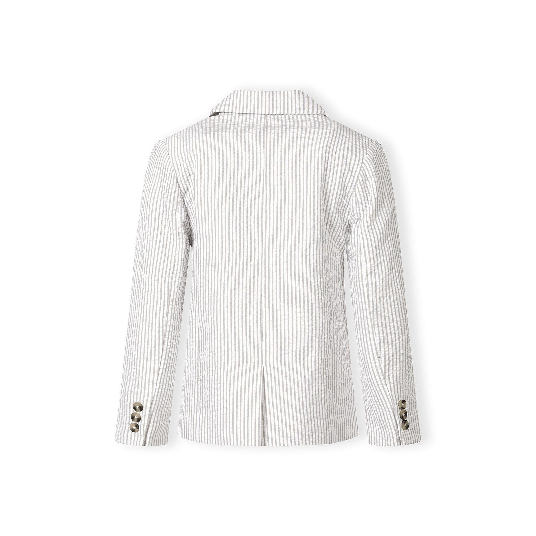 Full body shot of smiling boy in stone striped blazer with white shirt and matching shorts, standing confidently on white background