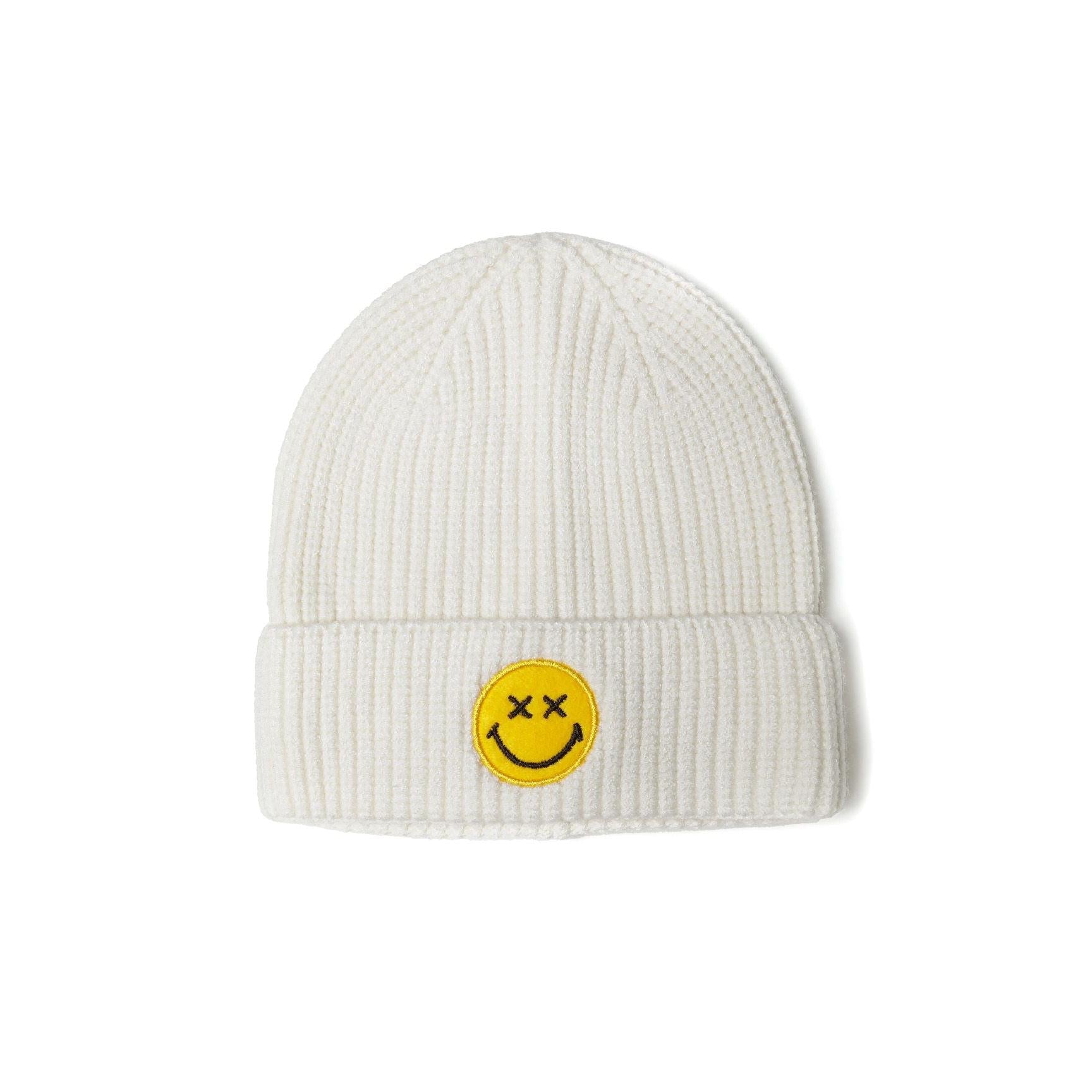 Cream ribbed knit beanie with yellow smiley face patch against white background