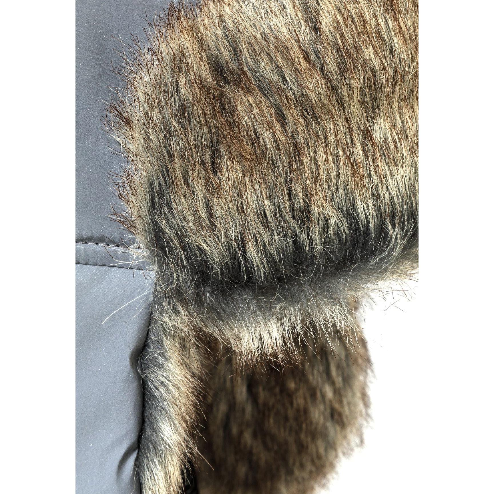 Close-up detail of brown and beige faux fur lining texture showing soft fluffy material