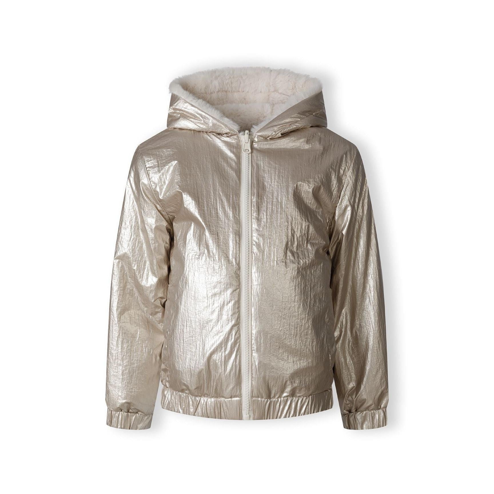 Close-up detail of beige metallic quilted fabric texture showing diamond pattern stitching and shiny surface finish