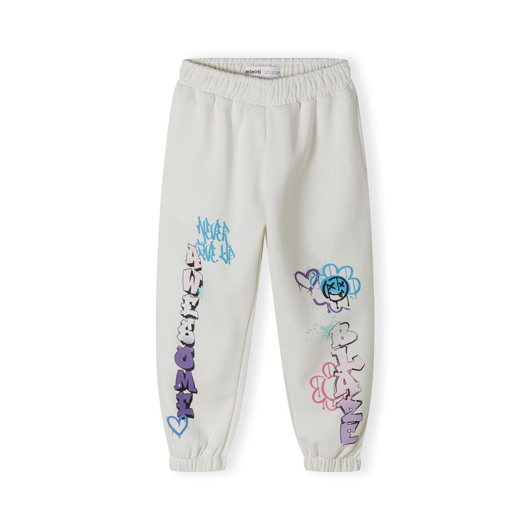 Close-up detail of cream hooded sweatshirt showing yellow and purple hand-drawn flower print and red graffiti text on chest area