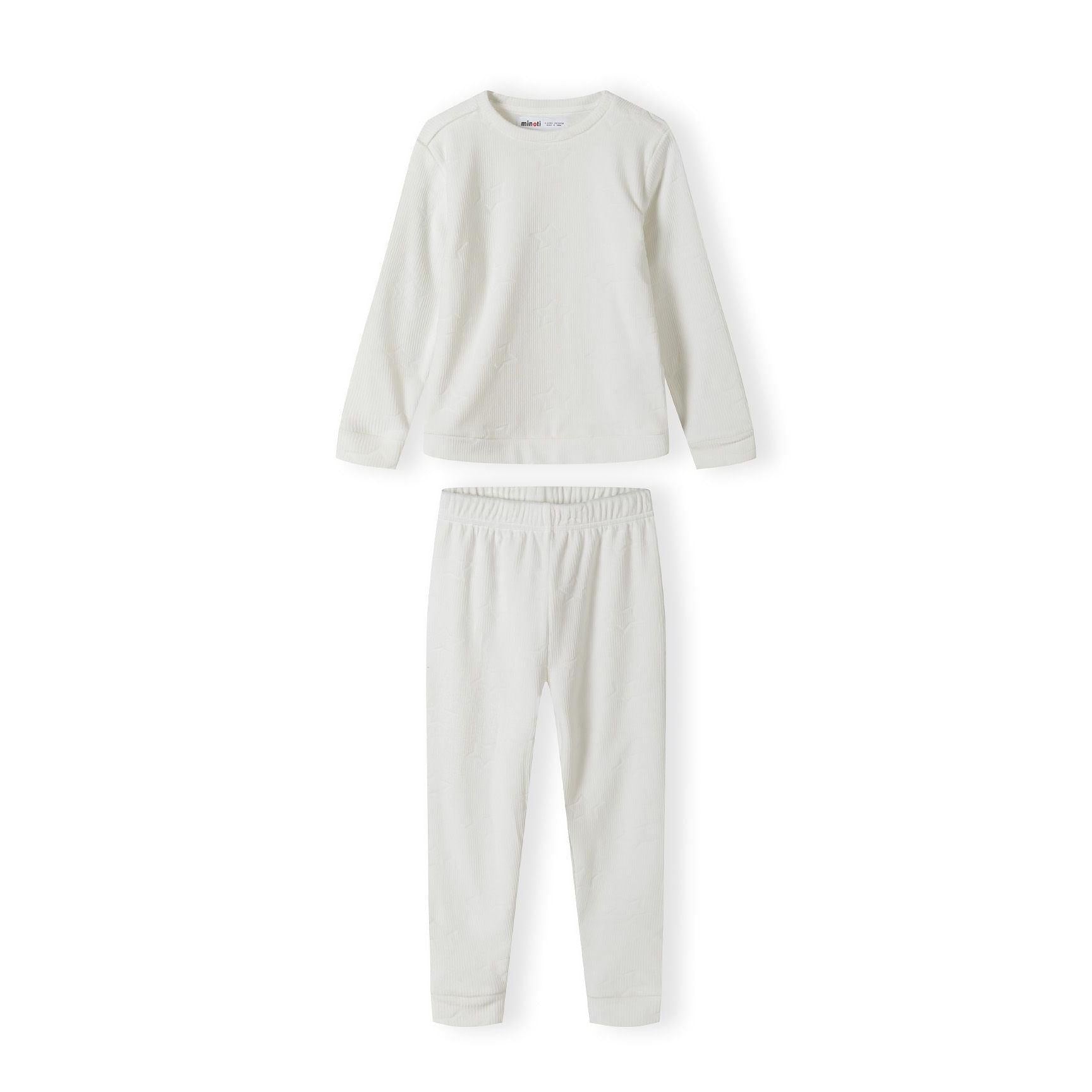 Cream velour pyjama set with all-over print showing long sleeve top and matching bottoms laid flat on white background