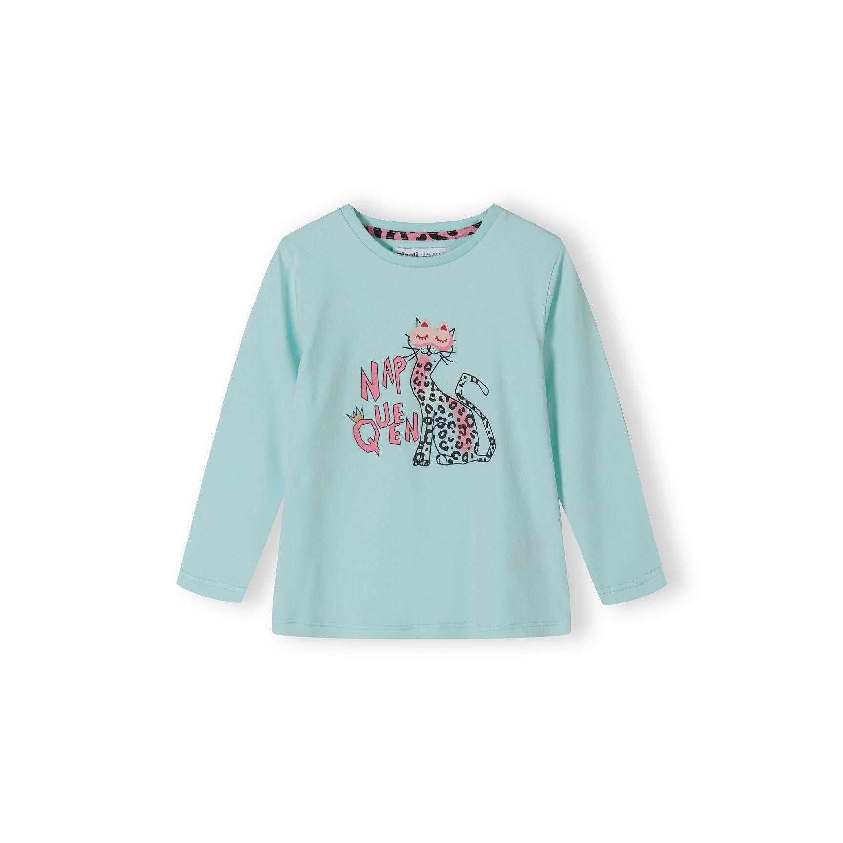 Close-up view of turquoise long sleeve pyjama top with Nap Queen text and sitting cat graphic with leopard print pattern on white background