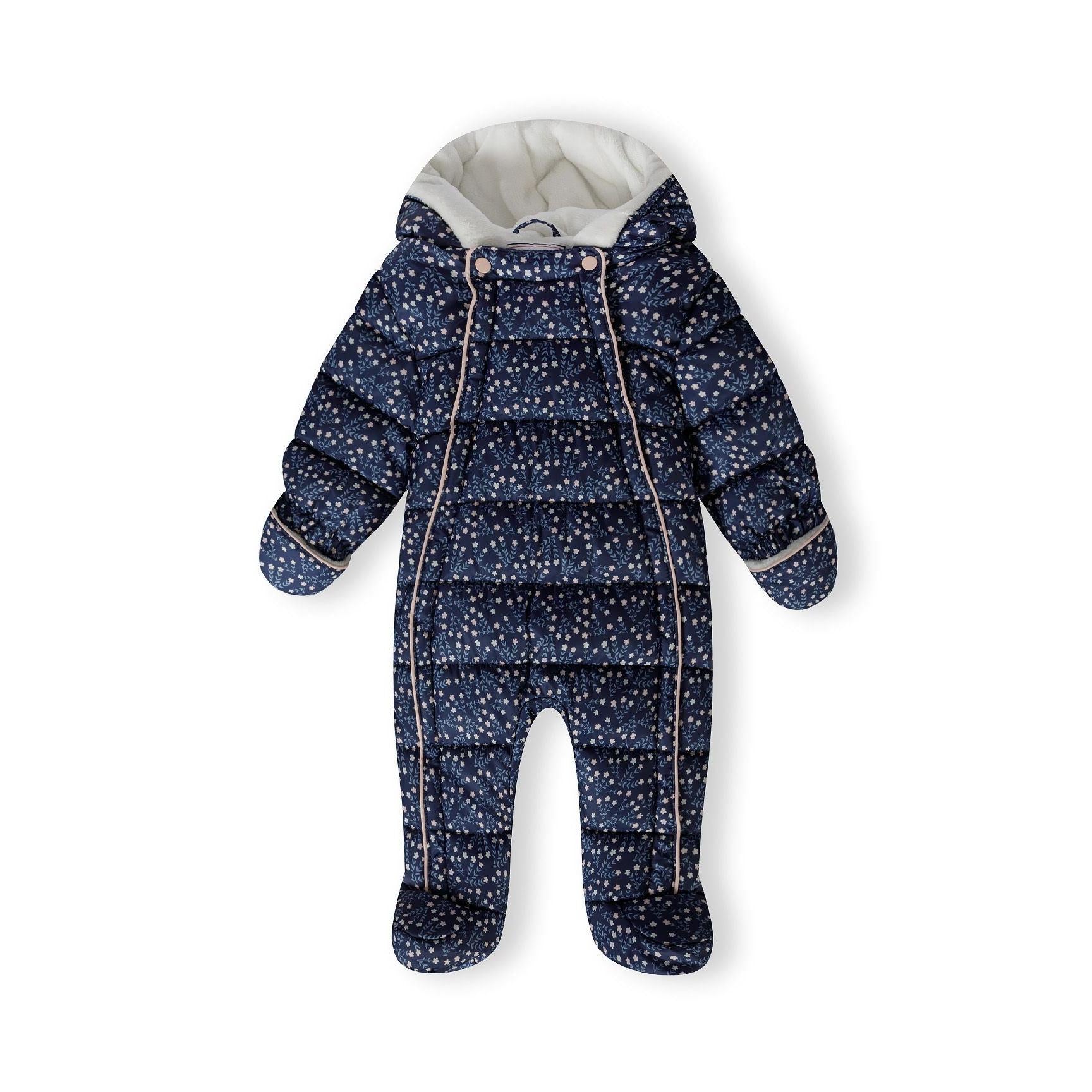 Navy floral snowsuit laid flat showing full zip closure, attached mittens, and cream hood lining with Minoti label visible