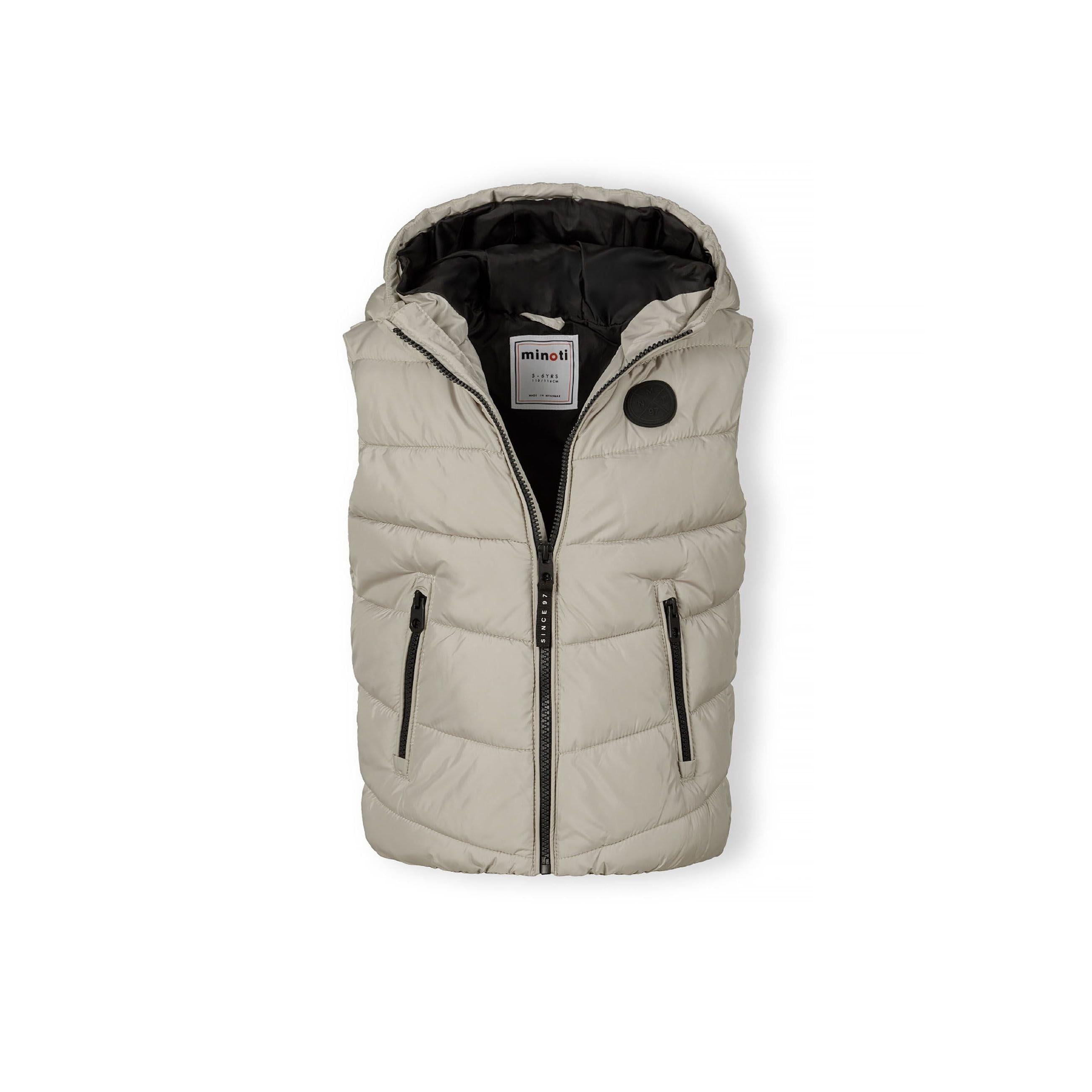 Flat lay of grey padded gilet with hood showing full front view with zip closure and two front pockets on white background