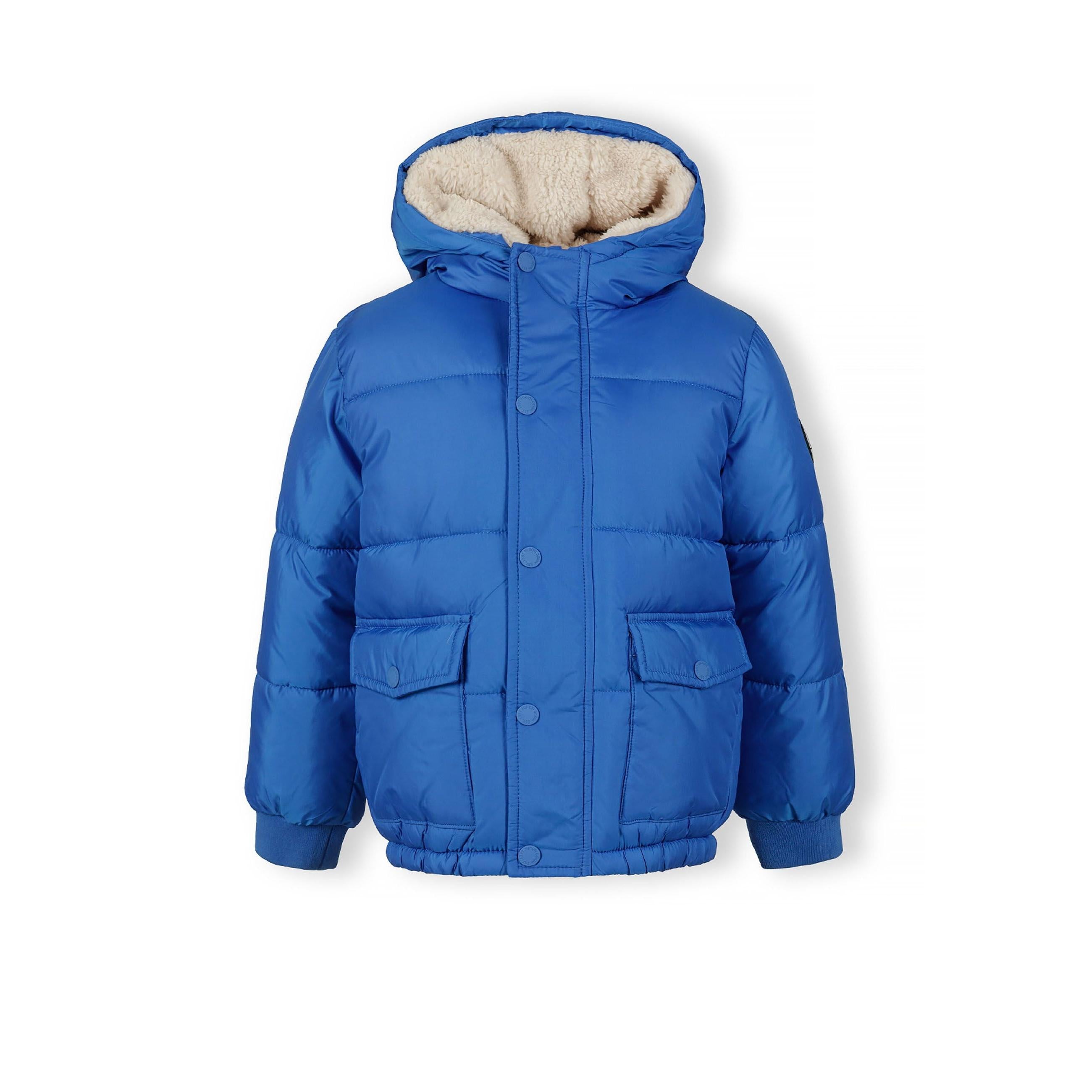 Cobalt blue hooded winter jacket laid flat showing teddy fleece lining, front pockets, and Minoti label against white background