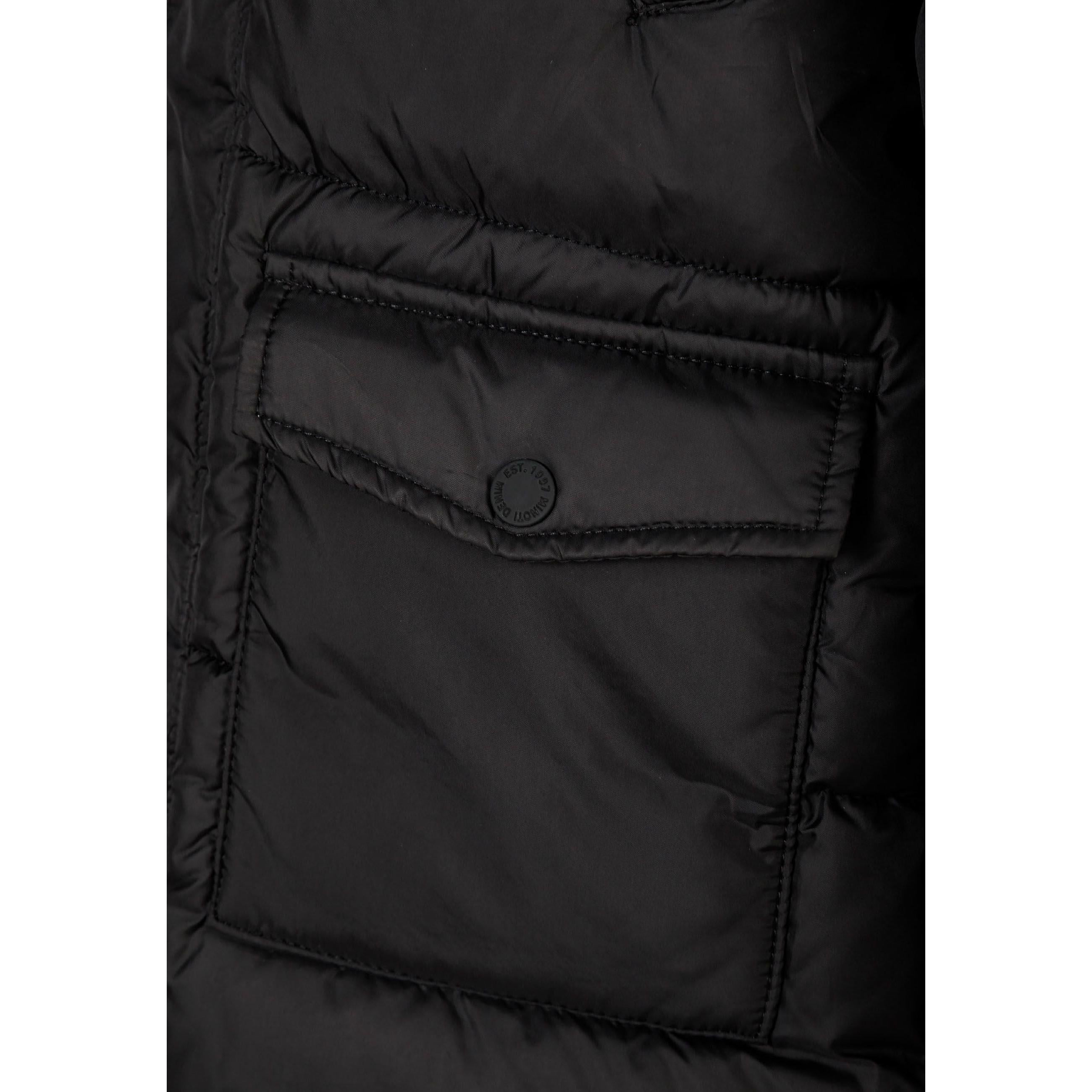 Close-up detail of black padded coat showing quilted stitching pattern and fabric texture