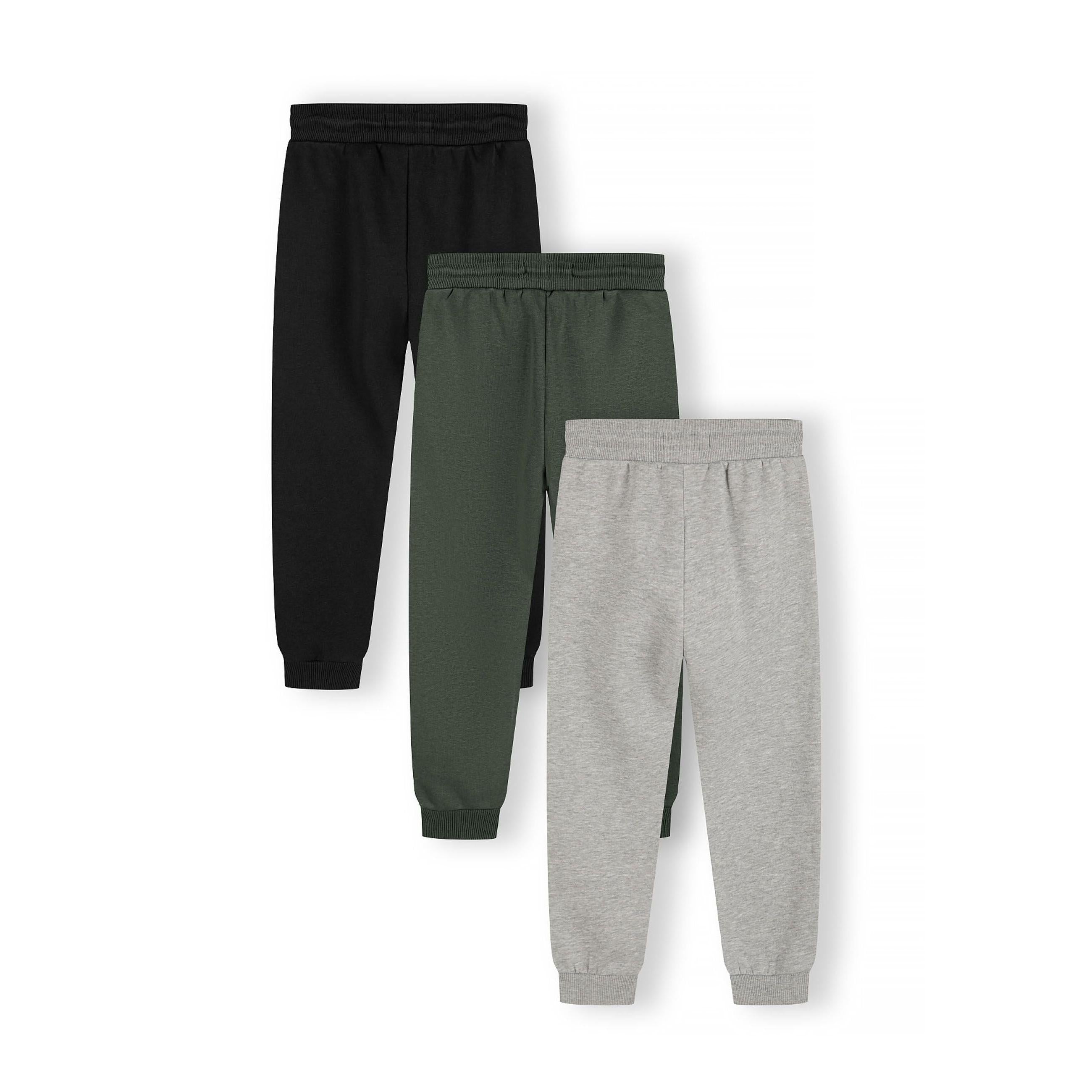 Single green joggers laid flat showing front view with drawstring waist, side pockets and ribbed ankle cuffs on white background