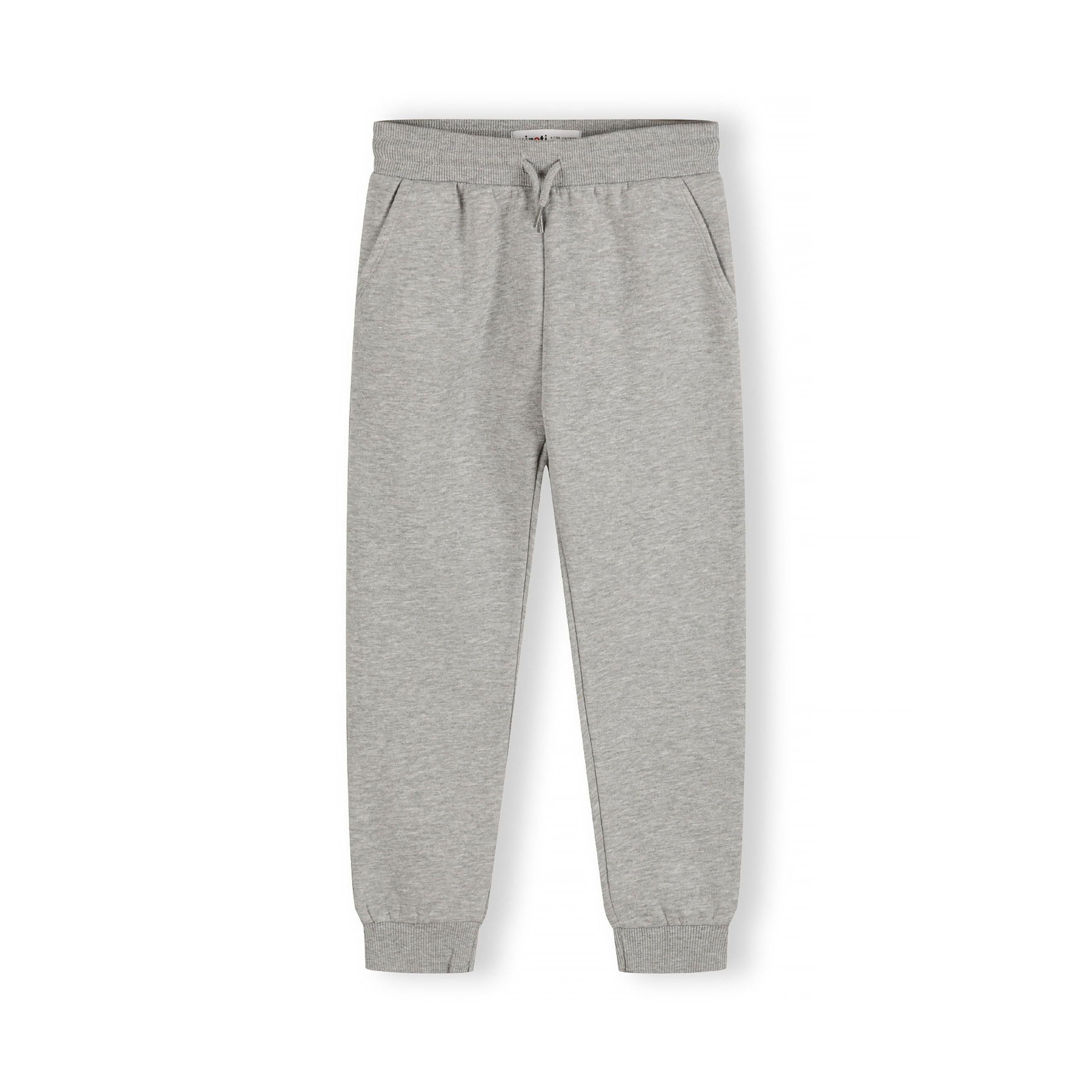 Single grey joggers laid flat showing front view with elasticated waist, side pockets and ribbed ankle cuffs on white background