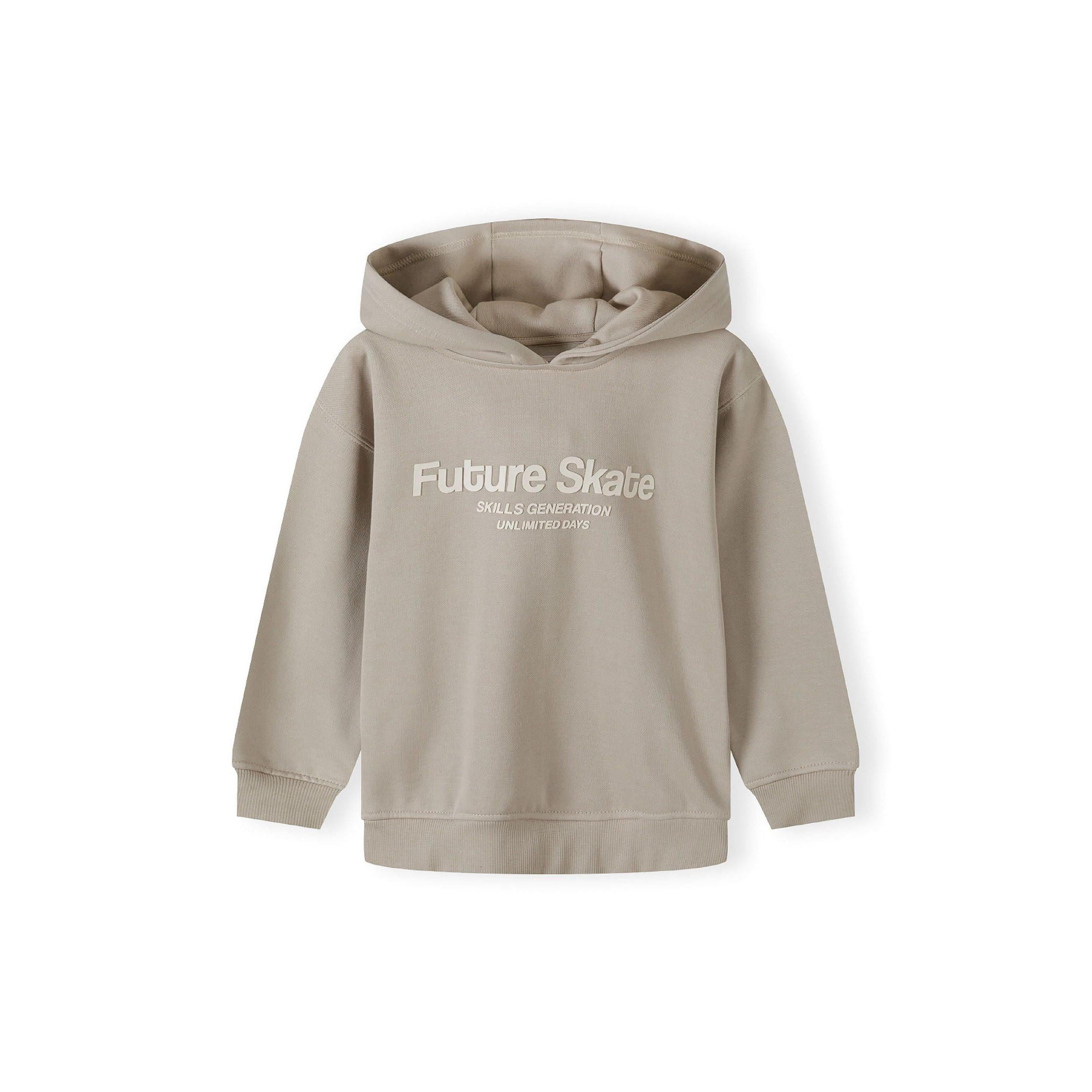 Close-up detail of grey joggers showing elastic waistband with drawstring, side pocket and Future Skate text print along the leg seam