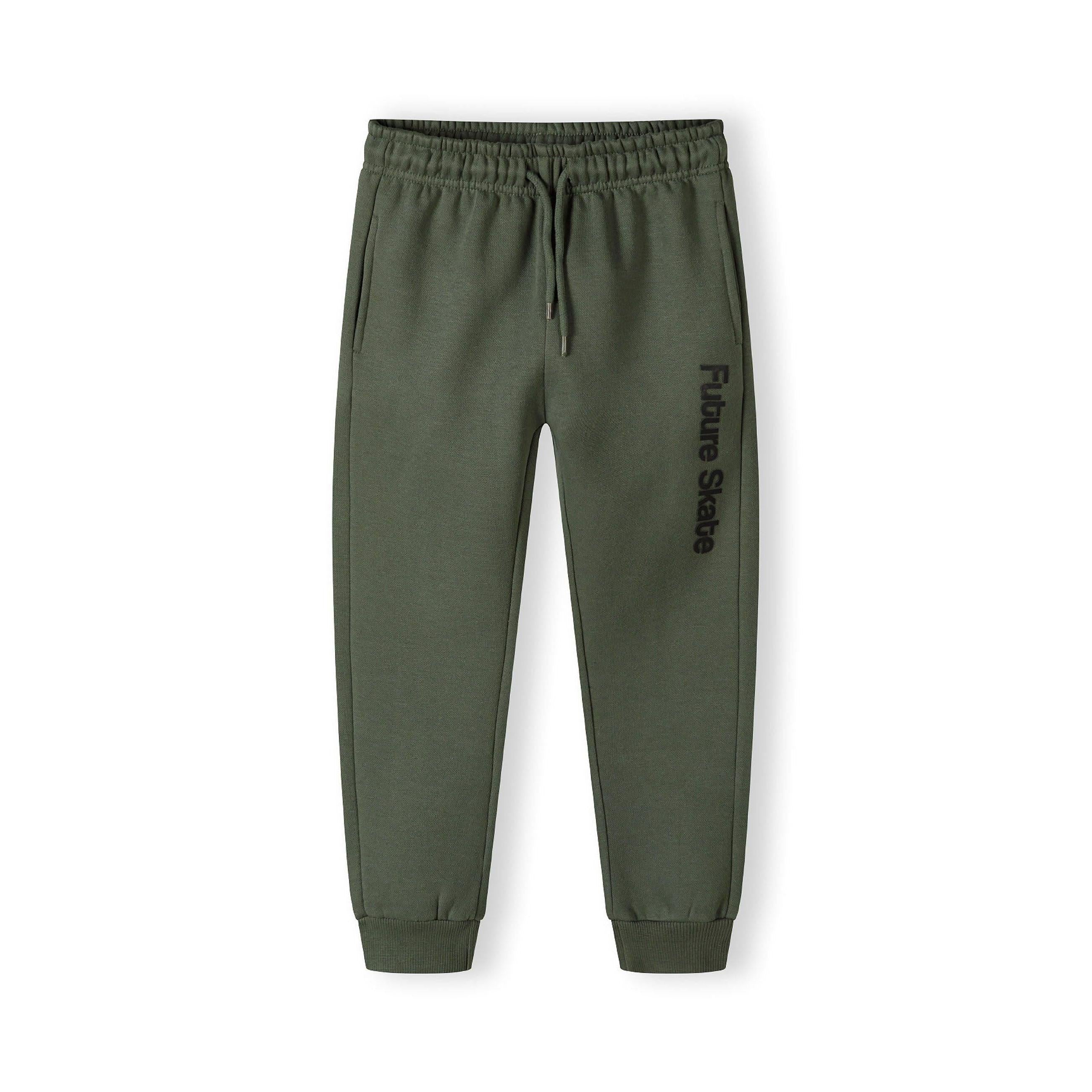 Khaki green jogger pants laid flat showing elastic waistband with drawstring and Future Skate text print on leg