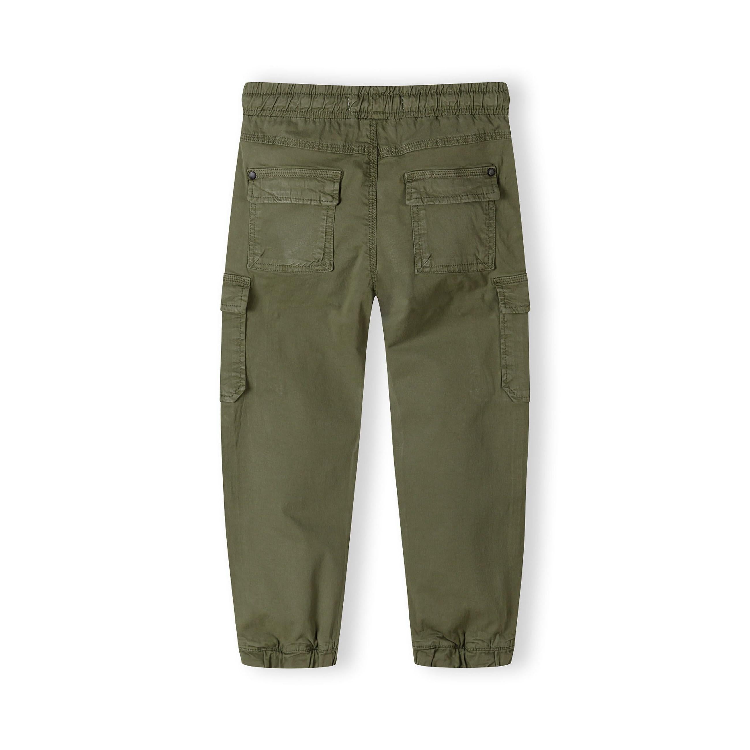Back view of khaki cargo trousers showing elasticated waistband, back pockets with button closure, and tapered ankle cuffs on white background