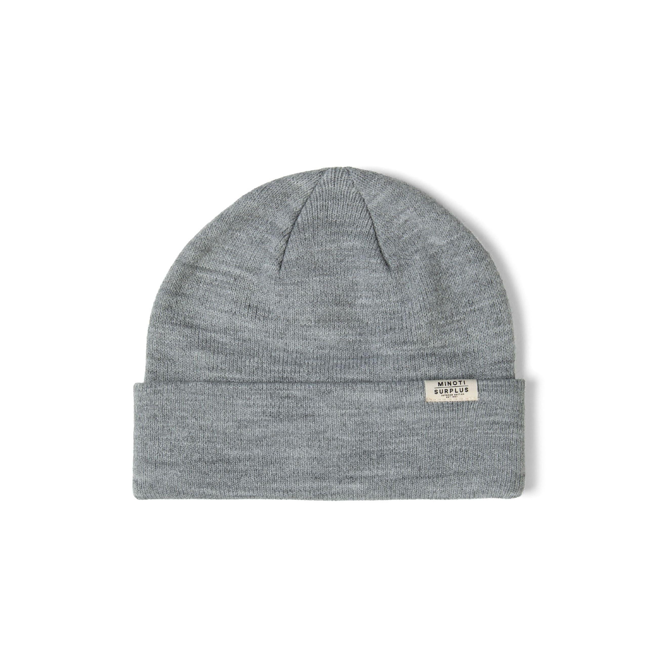 Single grey ribbed beanie hat on white background displaying knitted texture and white Minoti label on turned-up cuff