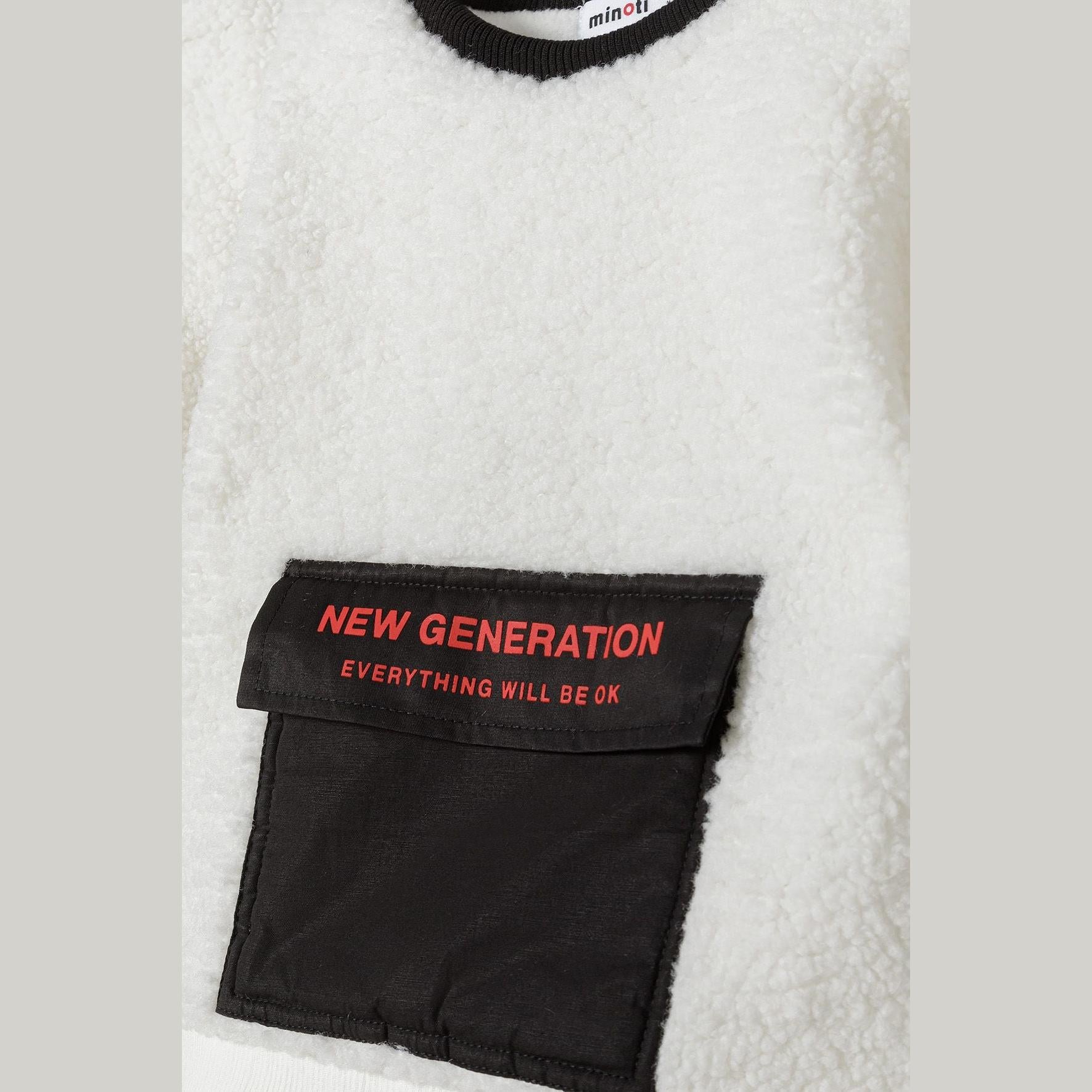 Close-up detail of black contrast pocket with red 'NEW GENERATION EVERYTHING WILL BE OK' text on cream borg sweatshirt fabric