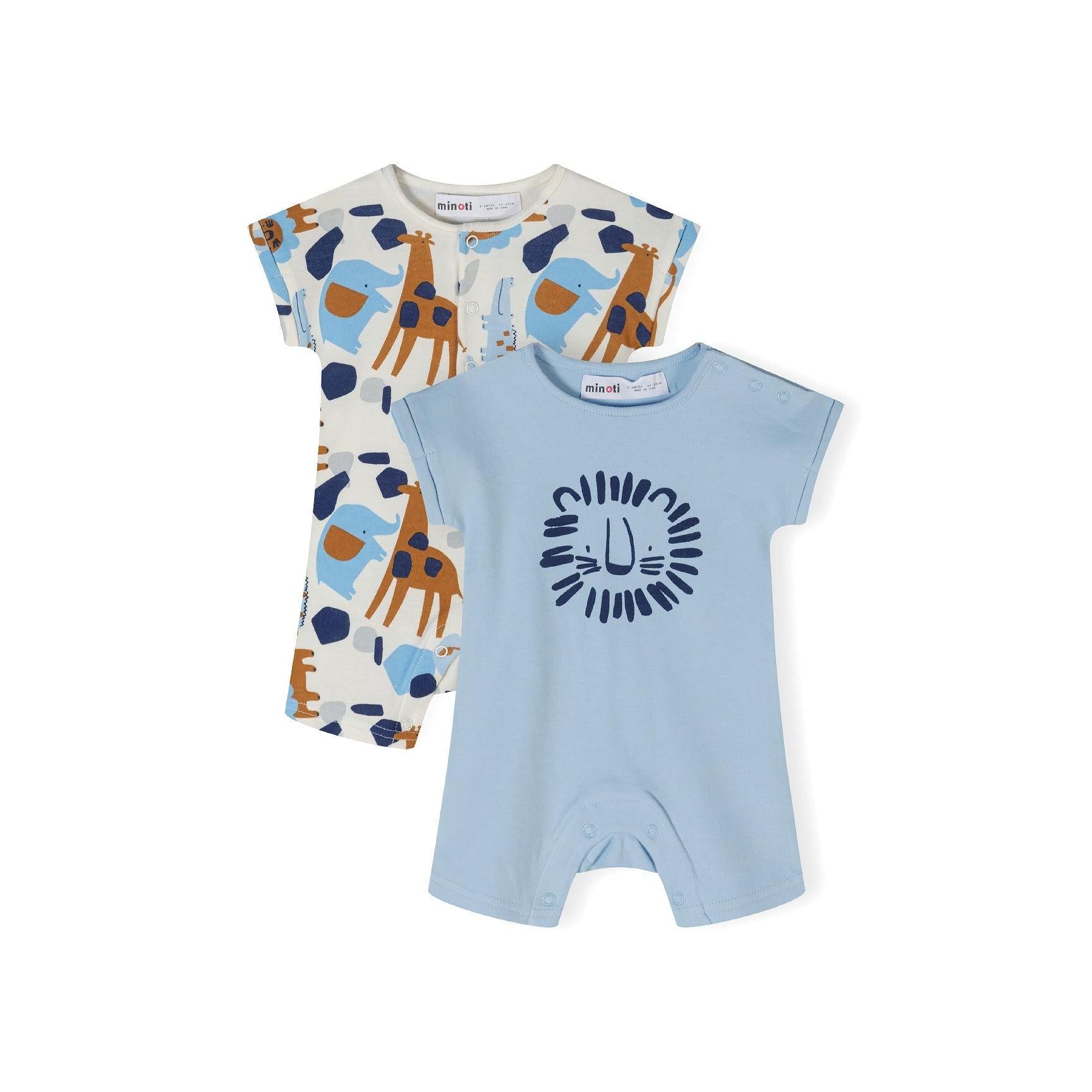 Two baby rompers on white background - one light blue with lion face print, one cream with safari animal pattern including giraffes and elephants