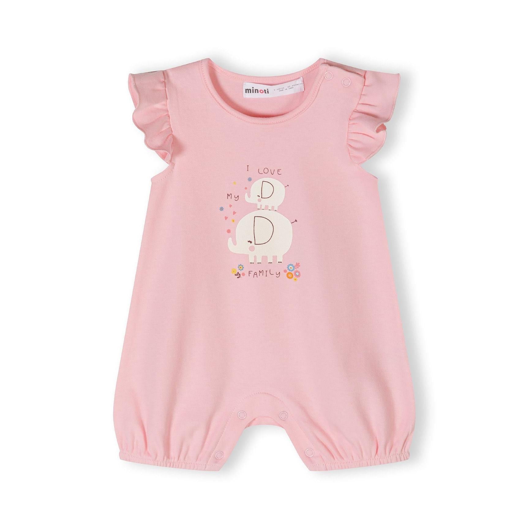 Close-up of cream romper with pink daisy pattern showing frill sleeve detail and Minoti label at neckline on white background