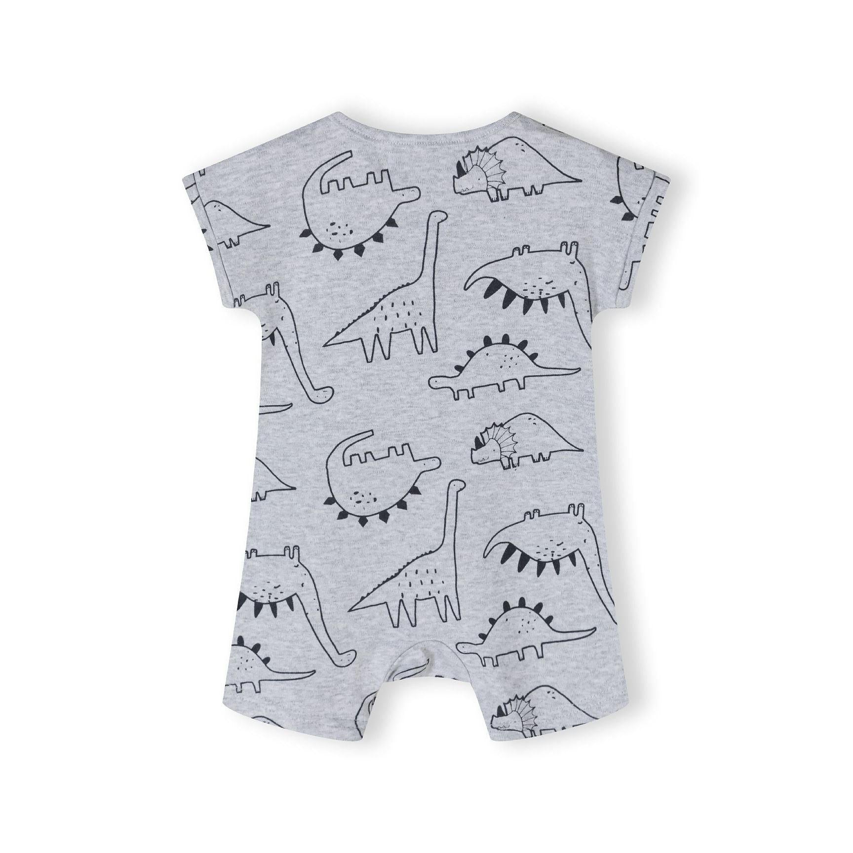 Detail of mint green romper showing snap button placket and white dinosaur applique with text 'be brave like a dinosaur!' on chest area