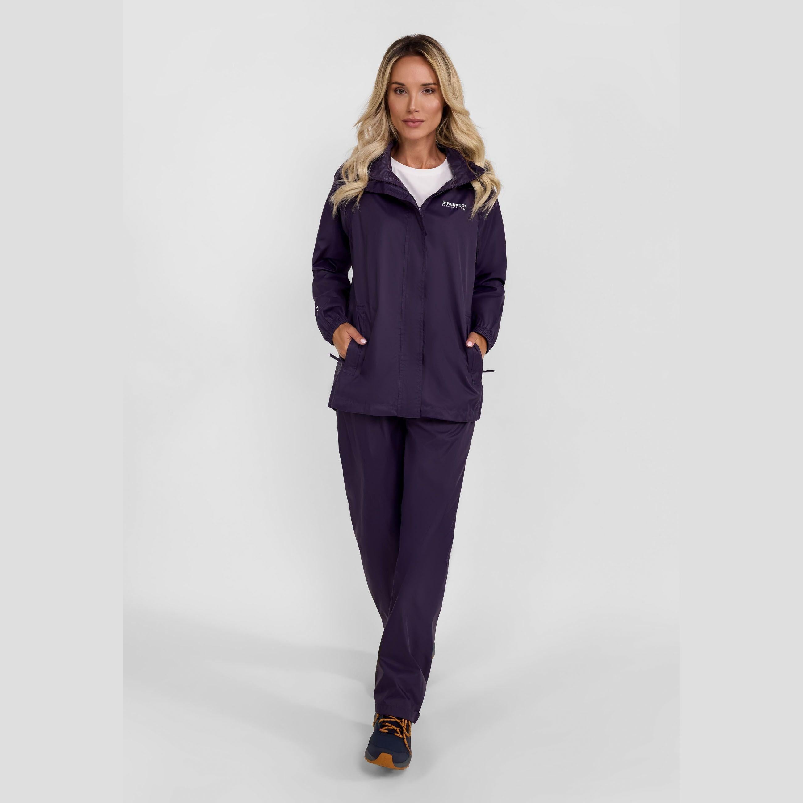 Purple waterproof overpants laid flat with small purple storage bag, showing packaway feature and Regatta branding label