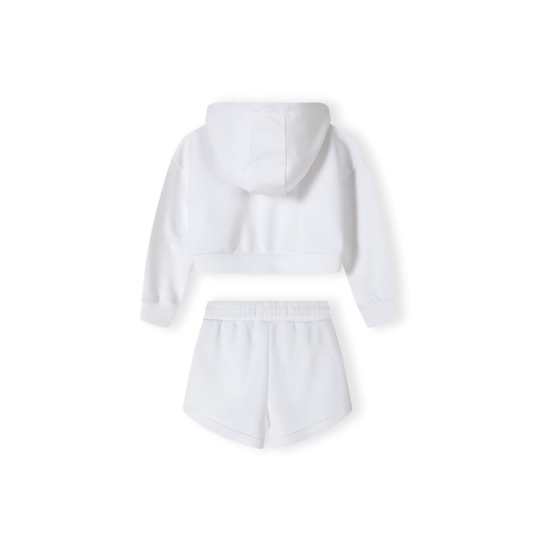 Close-up detail of white shorts showing pink circular L.A. logo with 'SMILE' text around the border