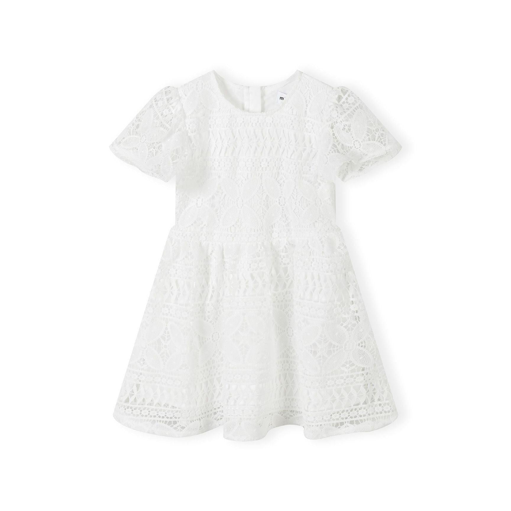White lace dress laid flat showing intricate lace pattern, flared sleeves and circle skirt design on white background