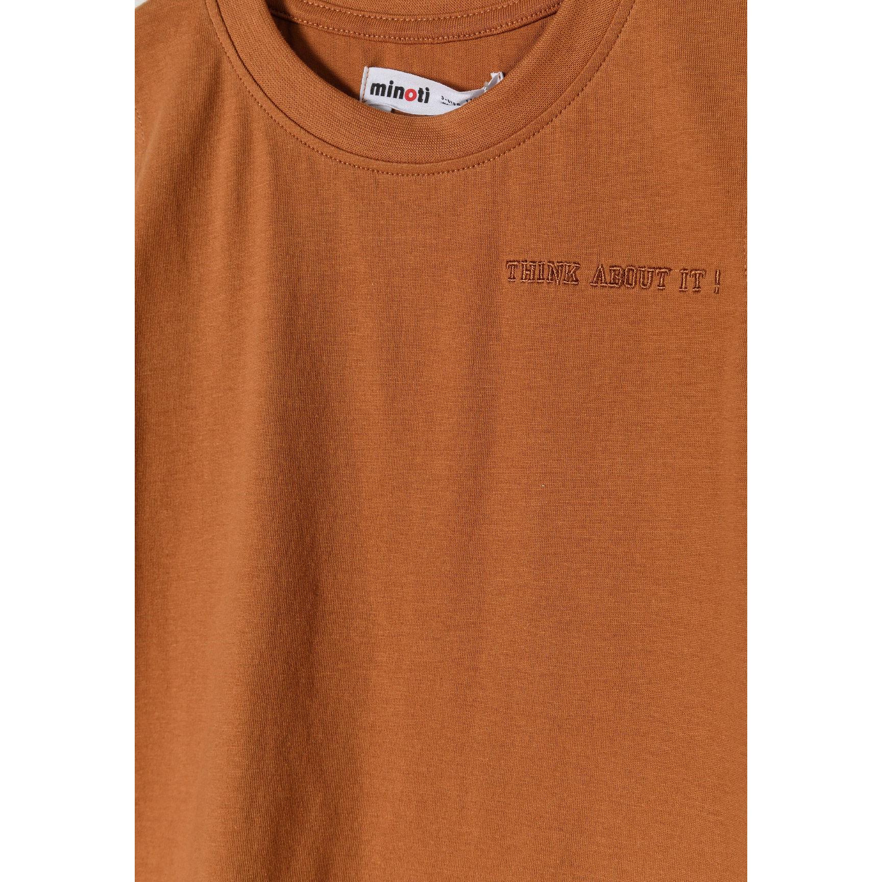 Close-up detail of camel brown shorts showing elasticated waistband with drawstring ties and soft jersey texture