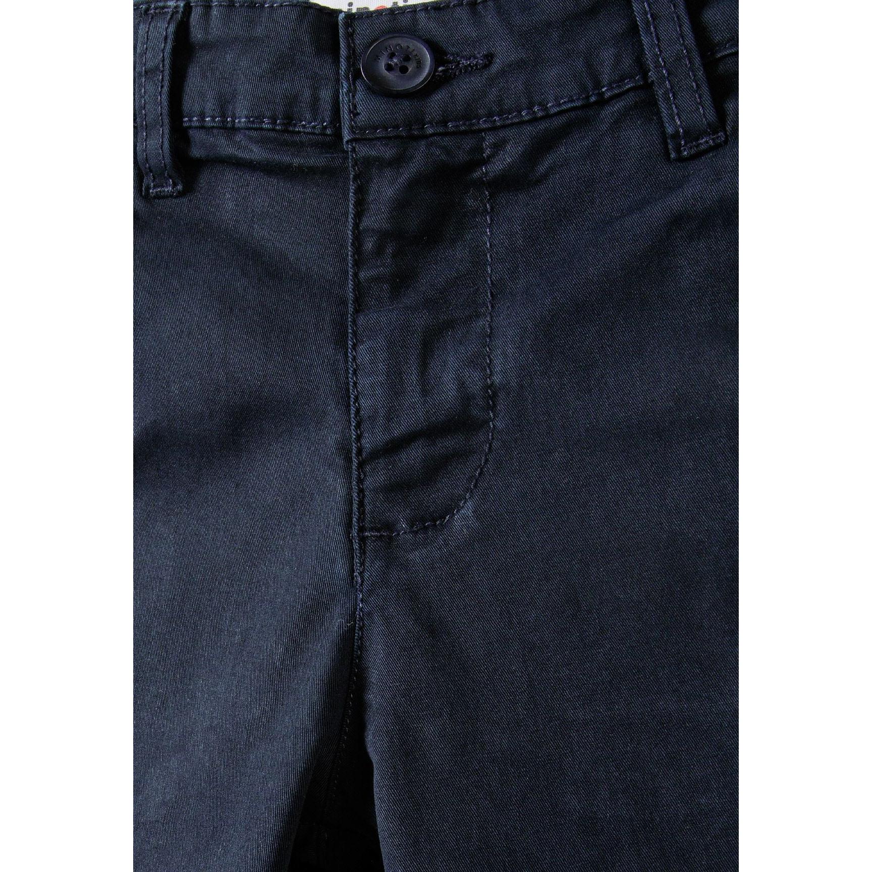Close-up detail of navy chino shorts waistband showing button closure and belt loop construction