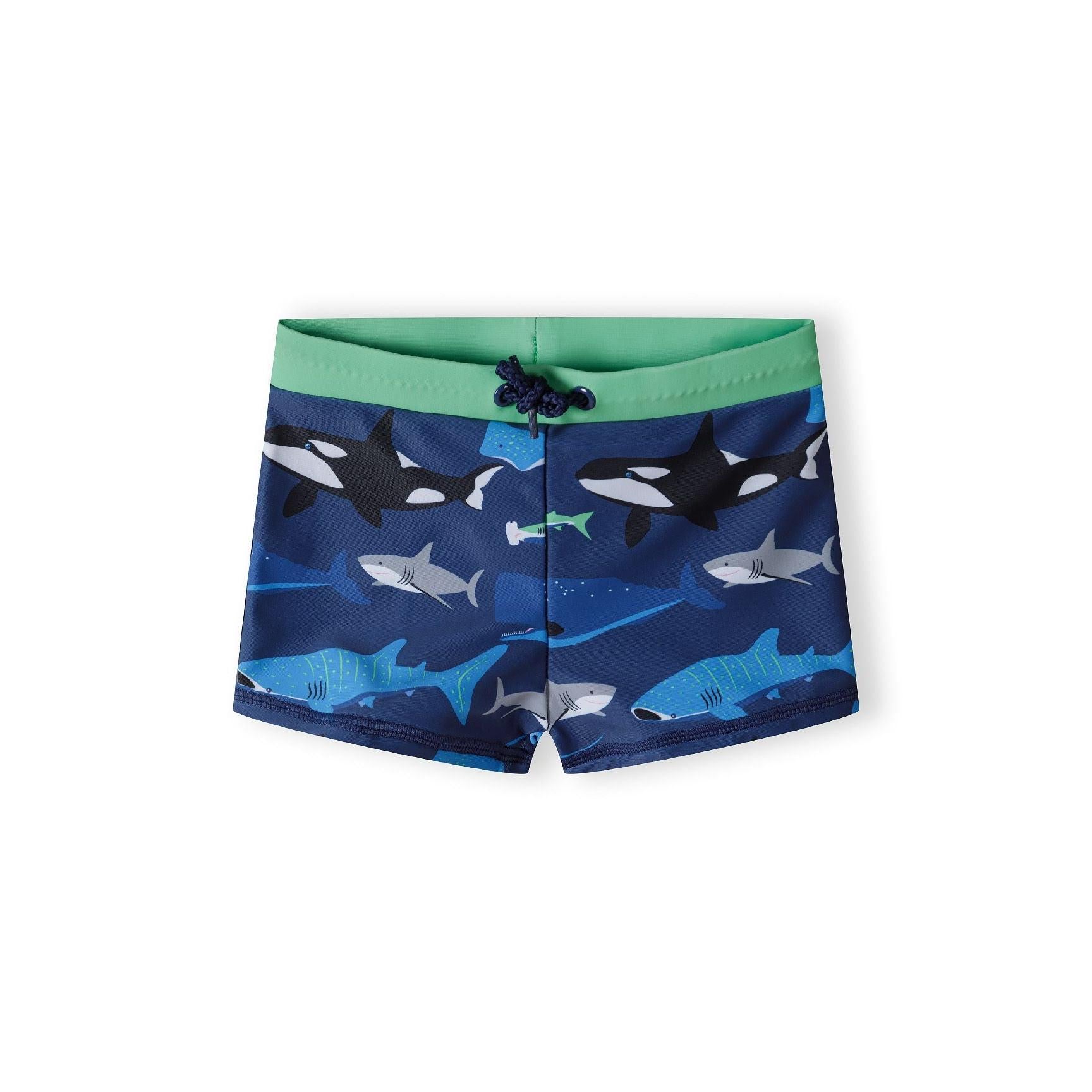 Close-up detail of green waistband with navy drawstring cord and toggle on sea creature printed rash shorts