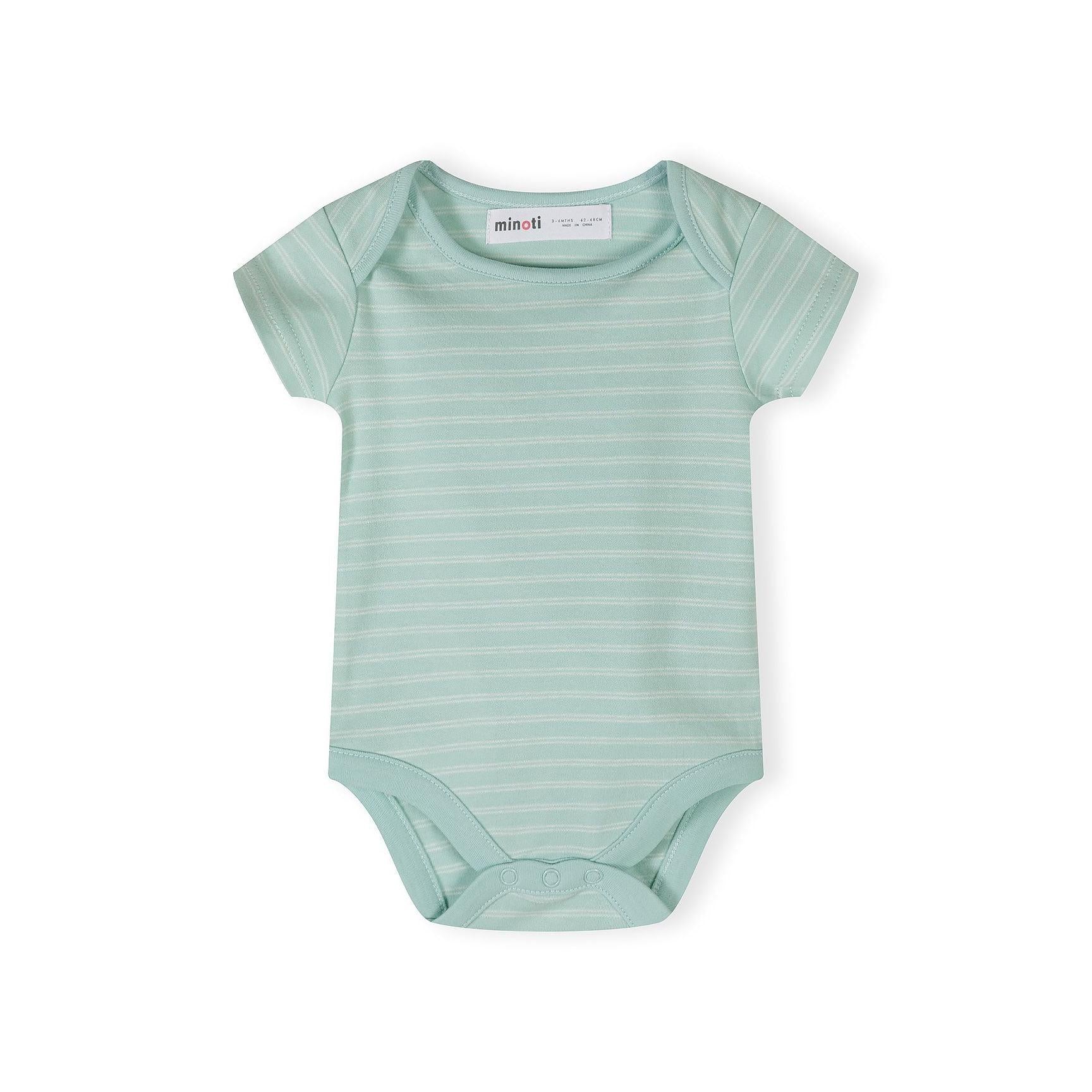 Close-up detail of cream bodysuit with colorful polka dots and safari print showing elephant, giraffe, lion, palm tree and 'Hello jungle FRIENDS' text with sun design