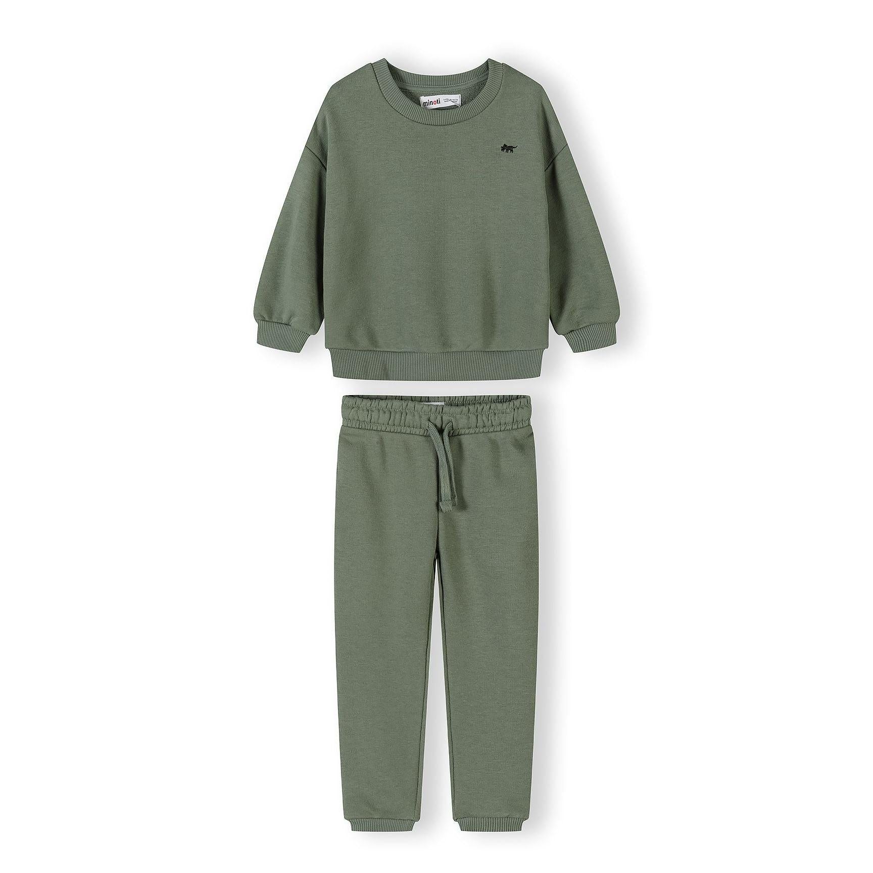 Black tracksuit set with sweatshirt and joggers laid flat showing classic sporty styling on white background