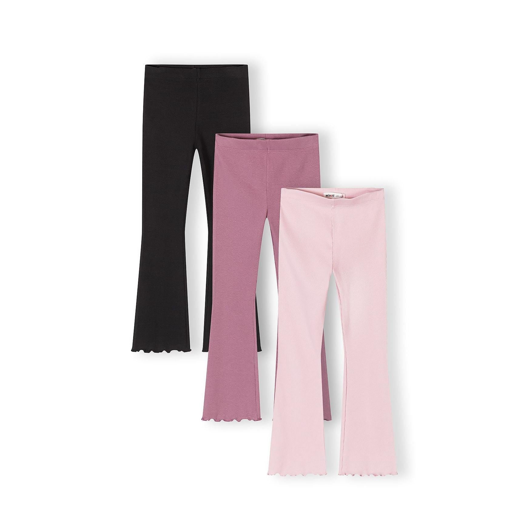 Three ribbed flare leggings laid flat showing black, purple and pink colors with scalloped hem details