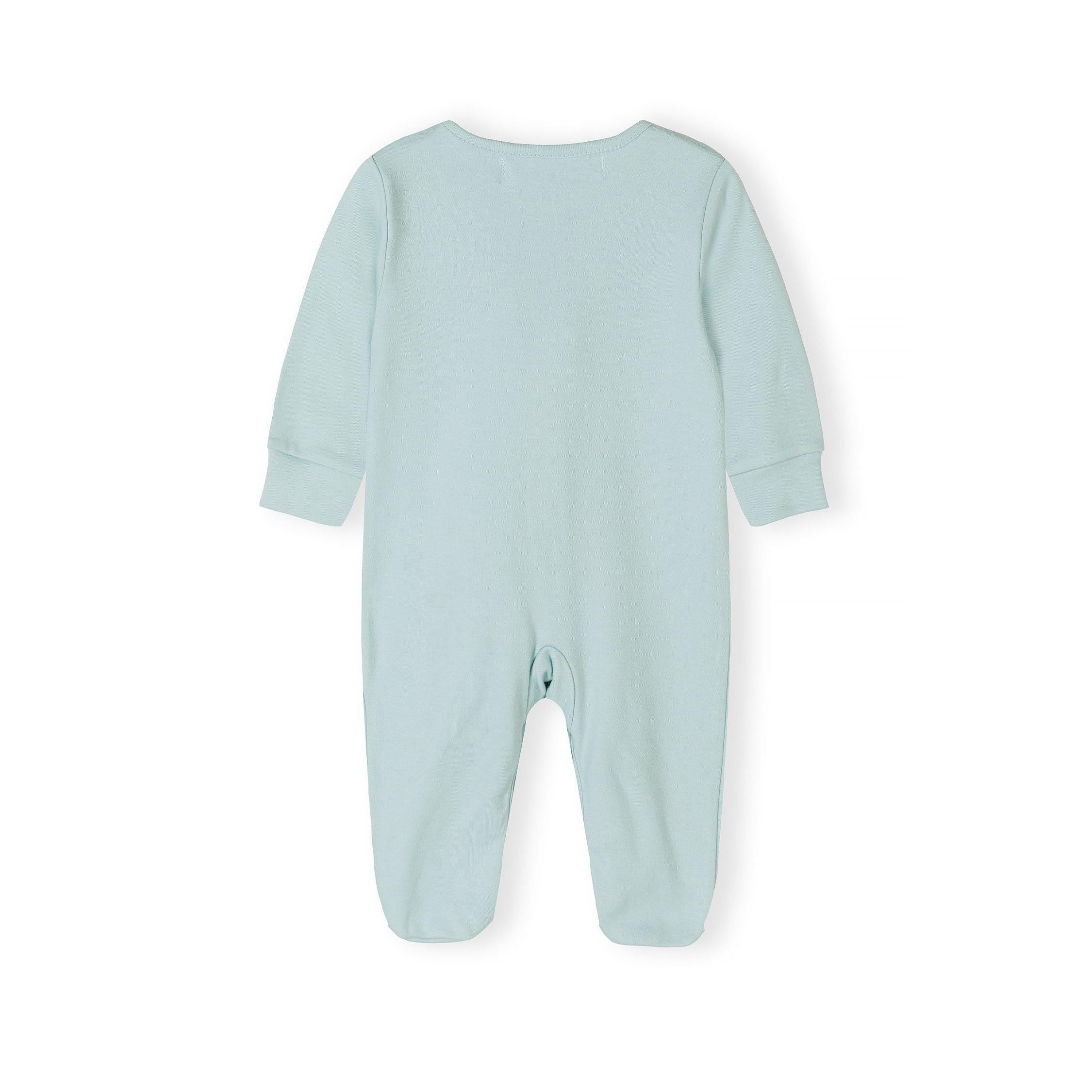 Close-up detail of pink sleepsuit showing Minoti brand label and snap button fastening system along the front opening